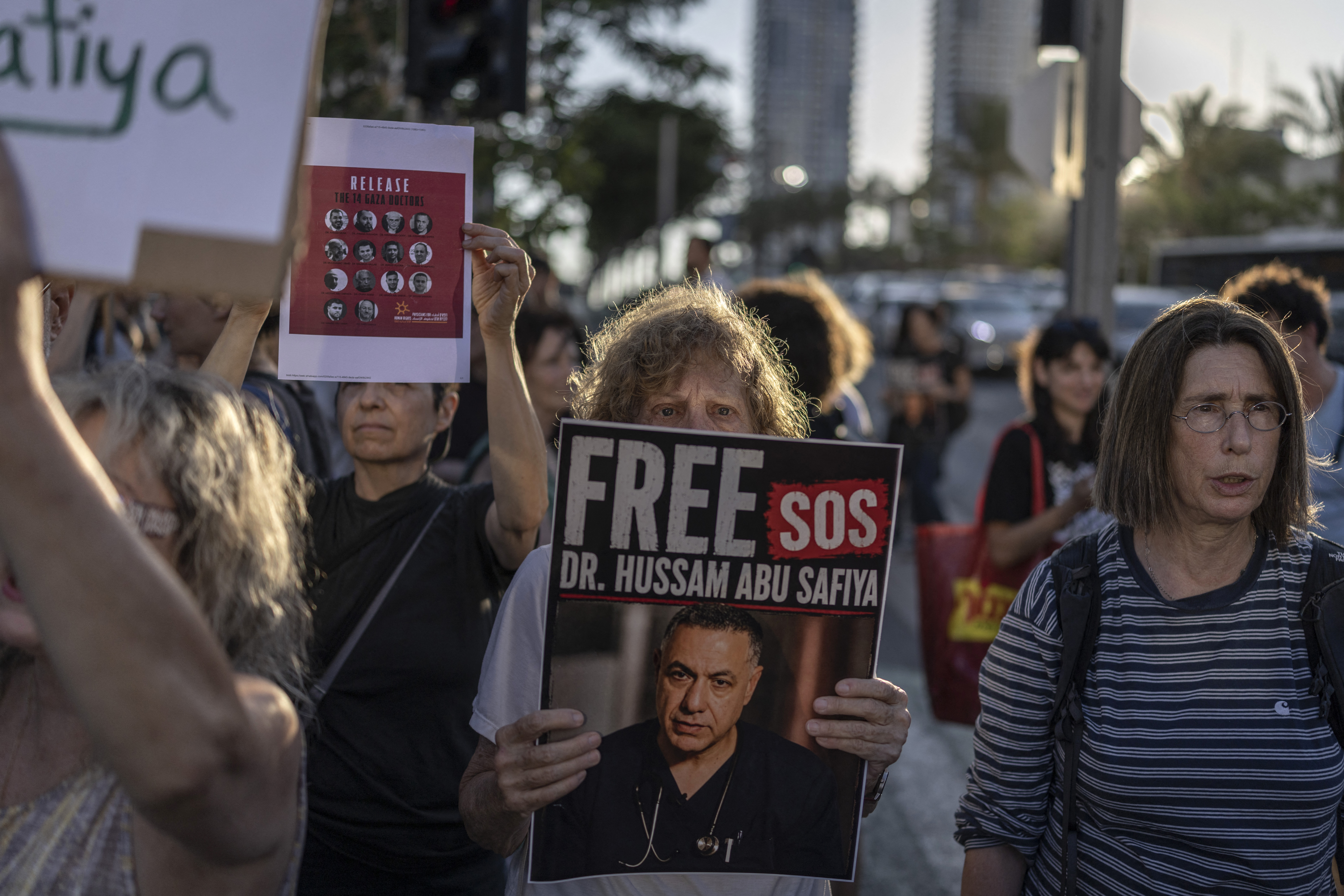 Israeli left-wing activists hold placards in Tel Aviv on July 6, 2026, during a rally calling for release of Palestinian Gaza Doctor Hussan Abu Safiya, detained by Israeli forces since December 2024.