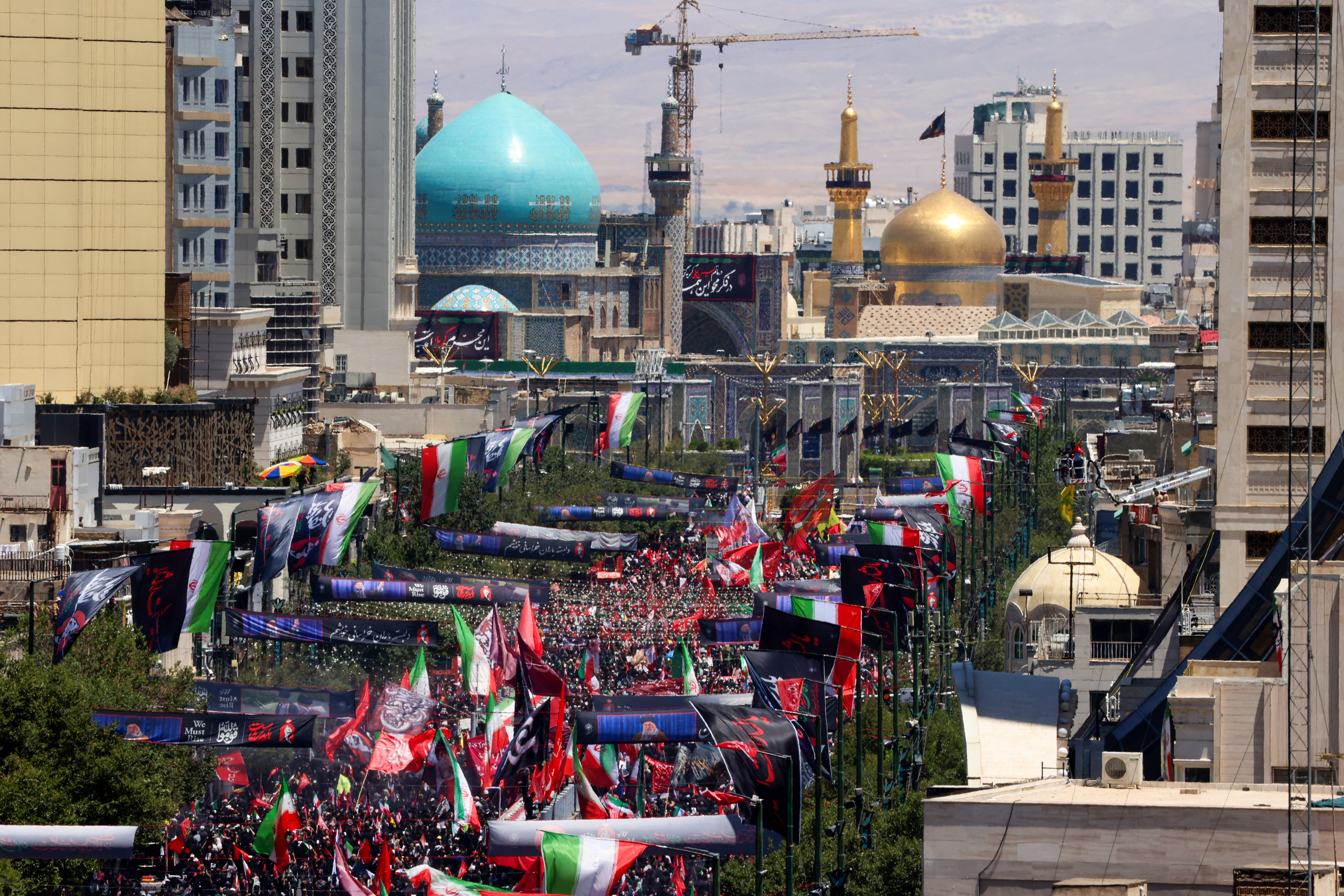 Mourners gather in the street ahead of the funeral of Iran's slain supreme leader Ali Khamenei and members of his family at the Shrine of Imam Reza, Iran's most revered place of worship, in Mashhad on July 9, 2026.