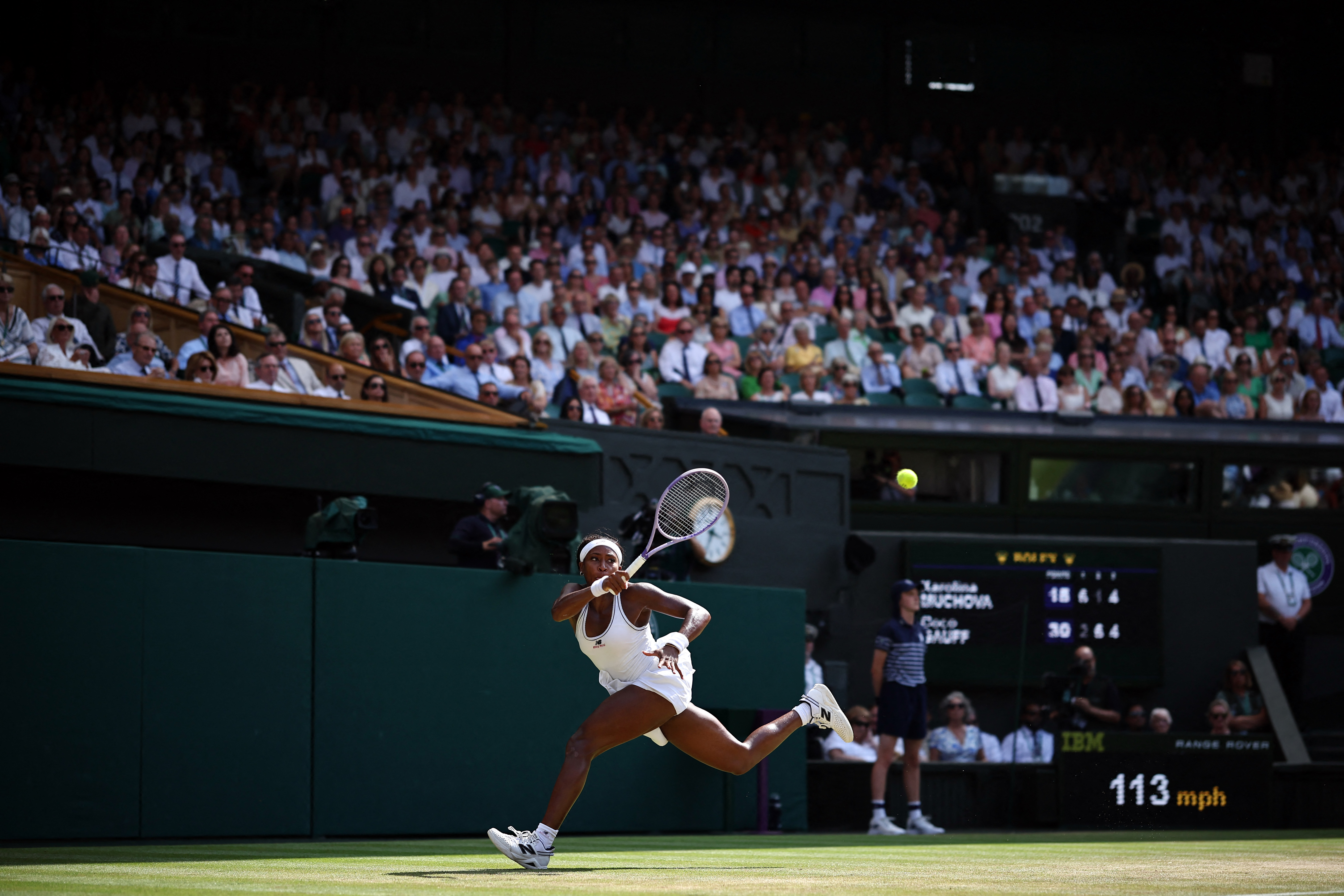 US player Coco Gauff returns to Czech Republic's Karolina Muchova during their women's singles semi-final tennis match on the eleventh day of the 2026 Wimbledon Championships at The All England Lawn Tennis and Croquet Club in Wimbledon, southwest London, on July 9, 2026. (Photo by HENRY NICHOLLS / AFP) / RESTRICTED TO EDITORIAL USE