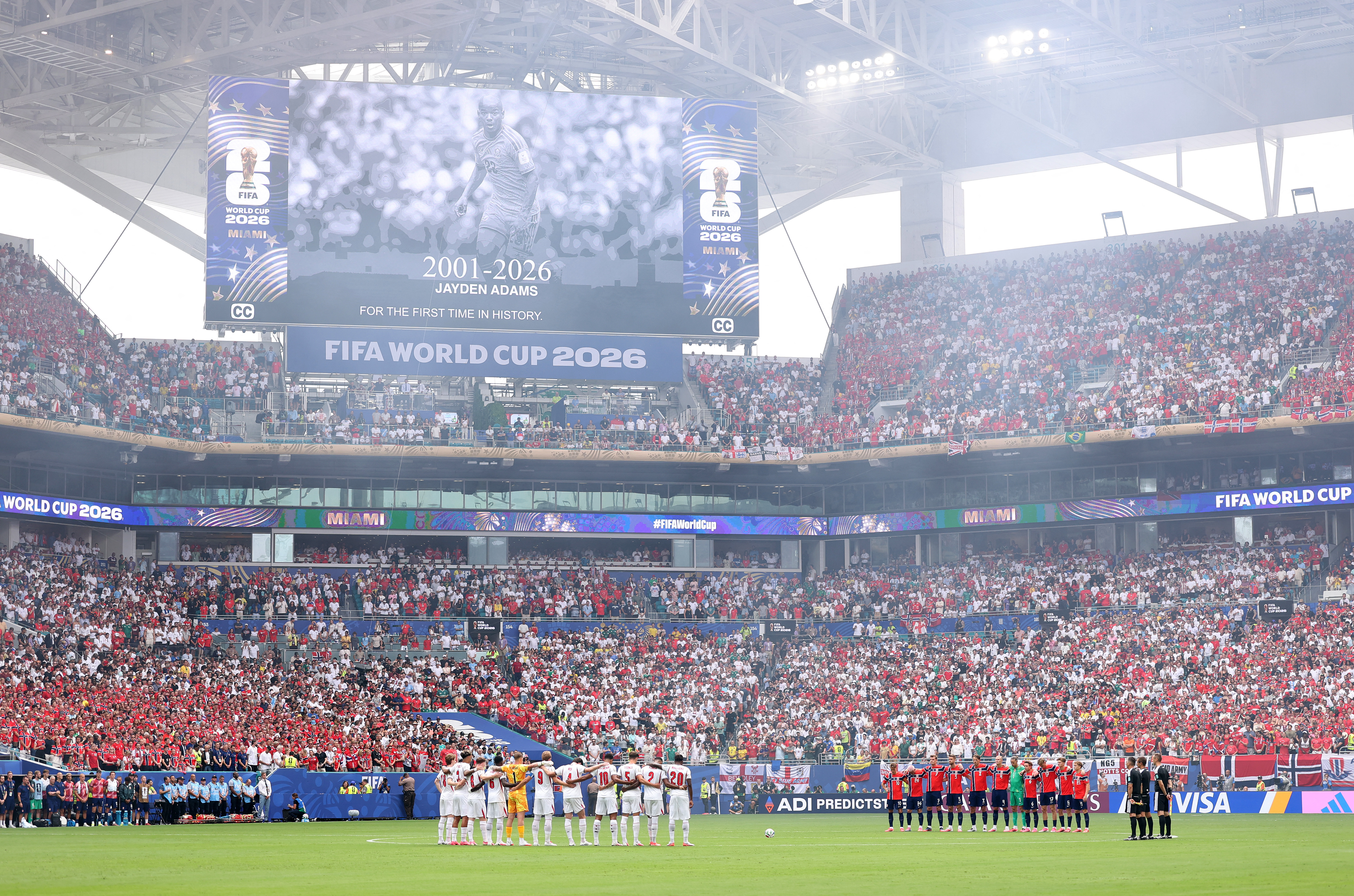 MIAMI GARDENS, FLORIDA - JULY 11: Players take a moment of silence for Jayden Adams of South Africa before the FIFA World Cup 2026 Quarter Final match between Norway and England at Miami Stadium on July 11, 2026 in Miami Gardens, Florida. Justin Setterfield/Getty Images/AFP (Photo by Justin Setterfield / GETTY IMAGES NORTH AMERICA / Getty Images via AFP)