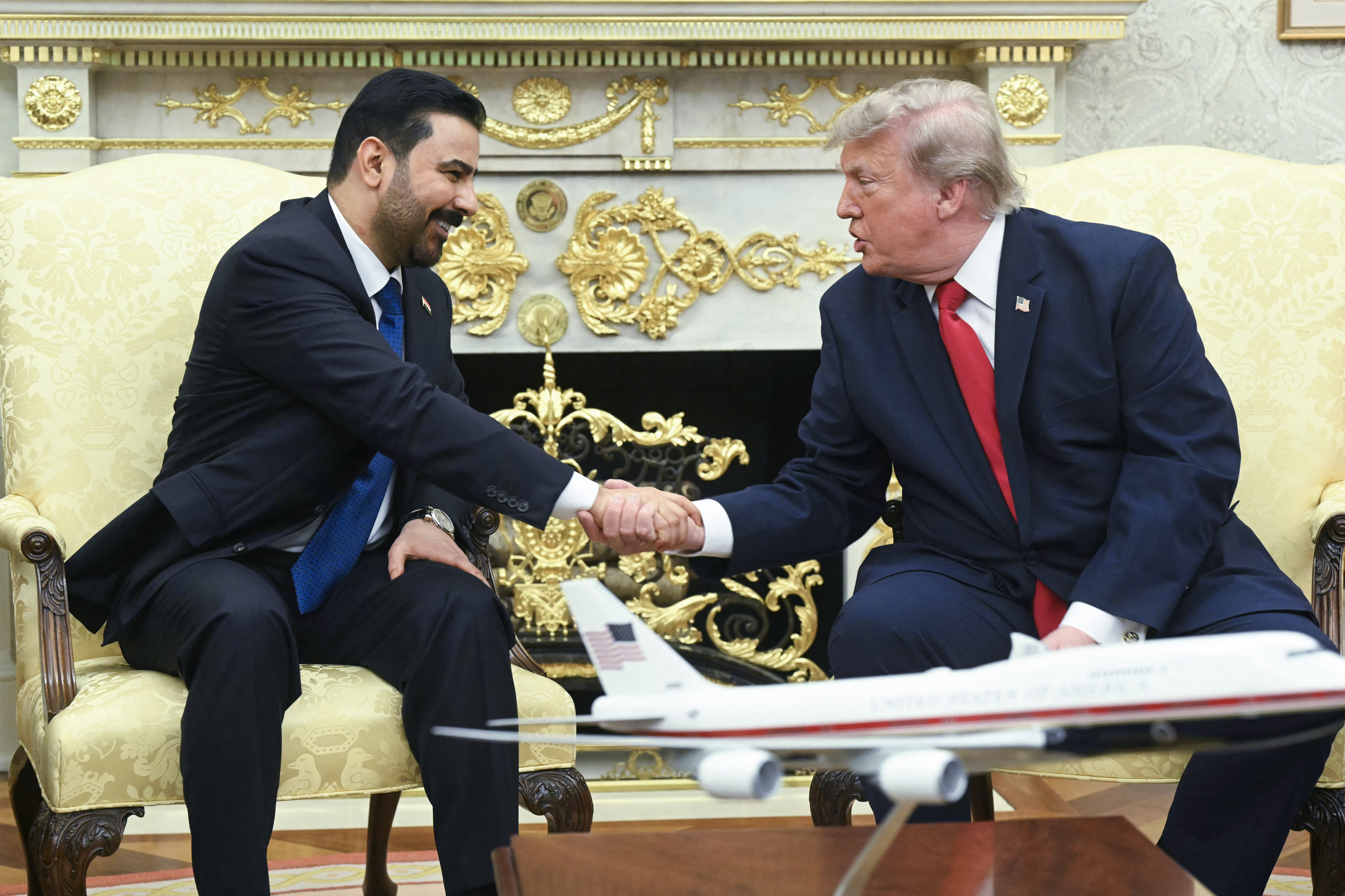 US President Donald Trump shakes hands with Prime Minister of Iraq Ali al-Zaidi (L) in the Oval Office of the White House in Washington, DC, on July 14, 2026. (Photo by SAUL LOEB / AFP)