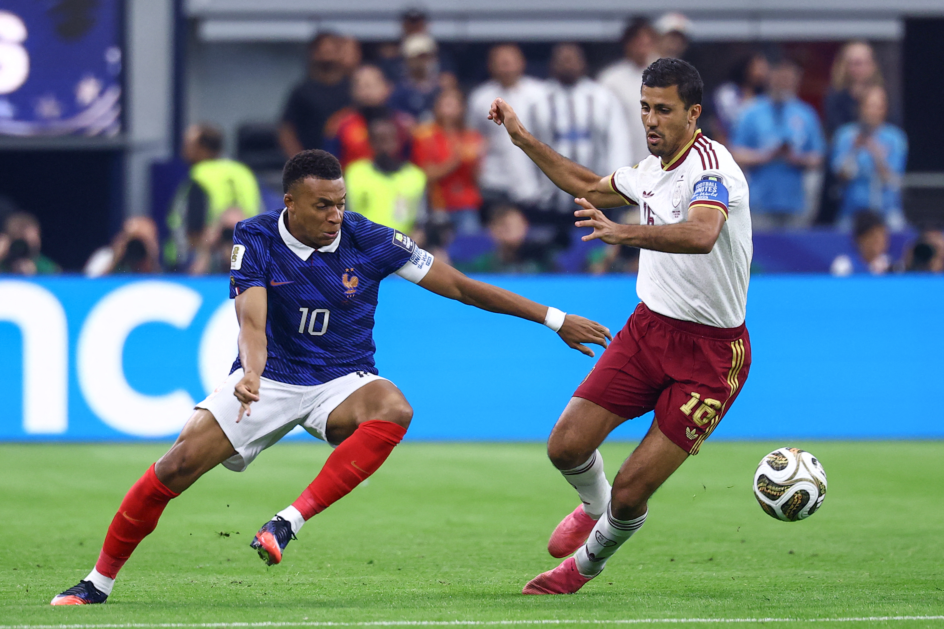 France's forward #10 Kylian Mbappe and Spain's midfielder #16 Rodri fight for the ball during the 2026 World Cup football tournament semi-final match between France and Spain at the Dallas Stadium in Arlington on July 14, 2026.