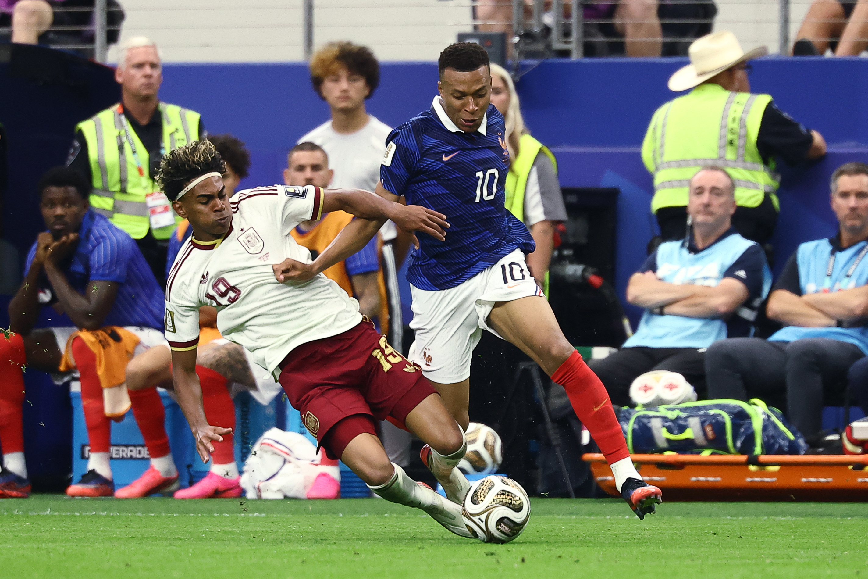 Spain's forward #19 Lamine Yamal fouls France's forward #10 Kylian Mbappe during the 2026 World Cup football tournament semi-final match between France and Spain at the Dallas Stadium in Arlington on July 14, 2026.