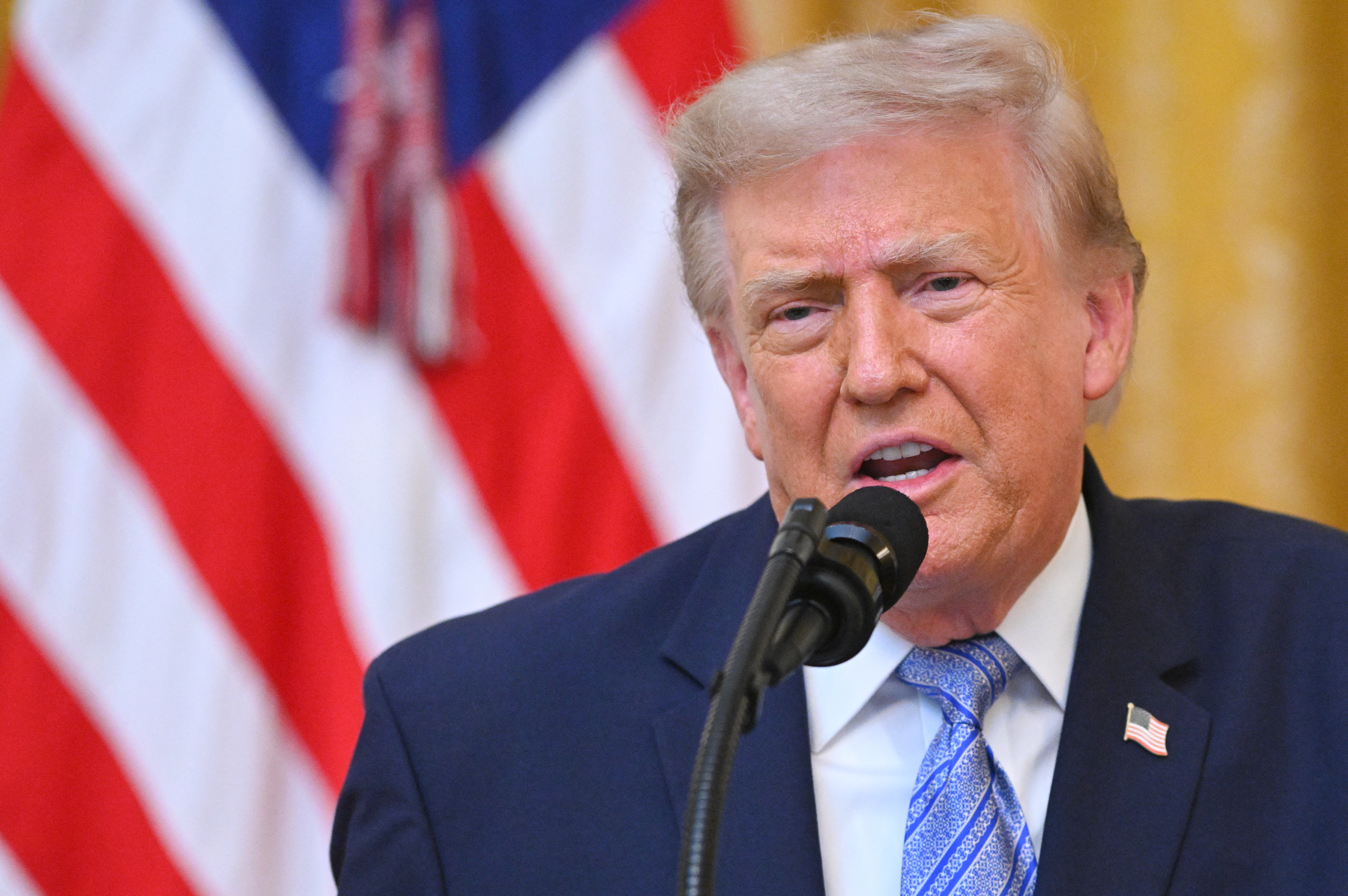 US President Donald Trump addresses the nation from the East Room of the White House in Washington, DC on July 16, 2026 [AFP]