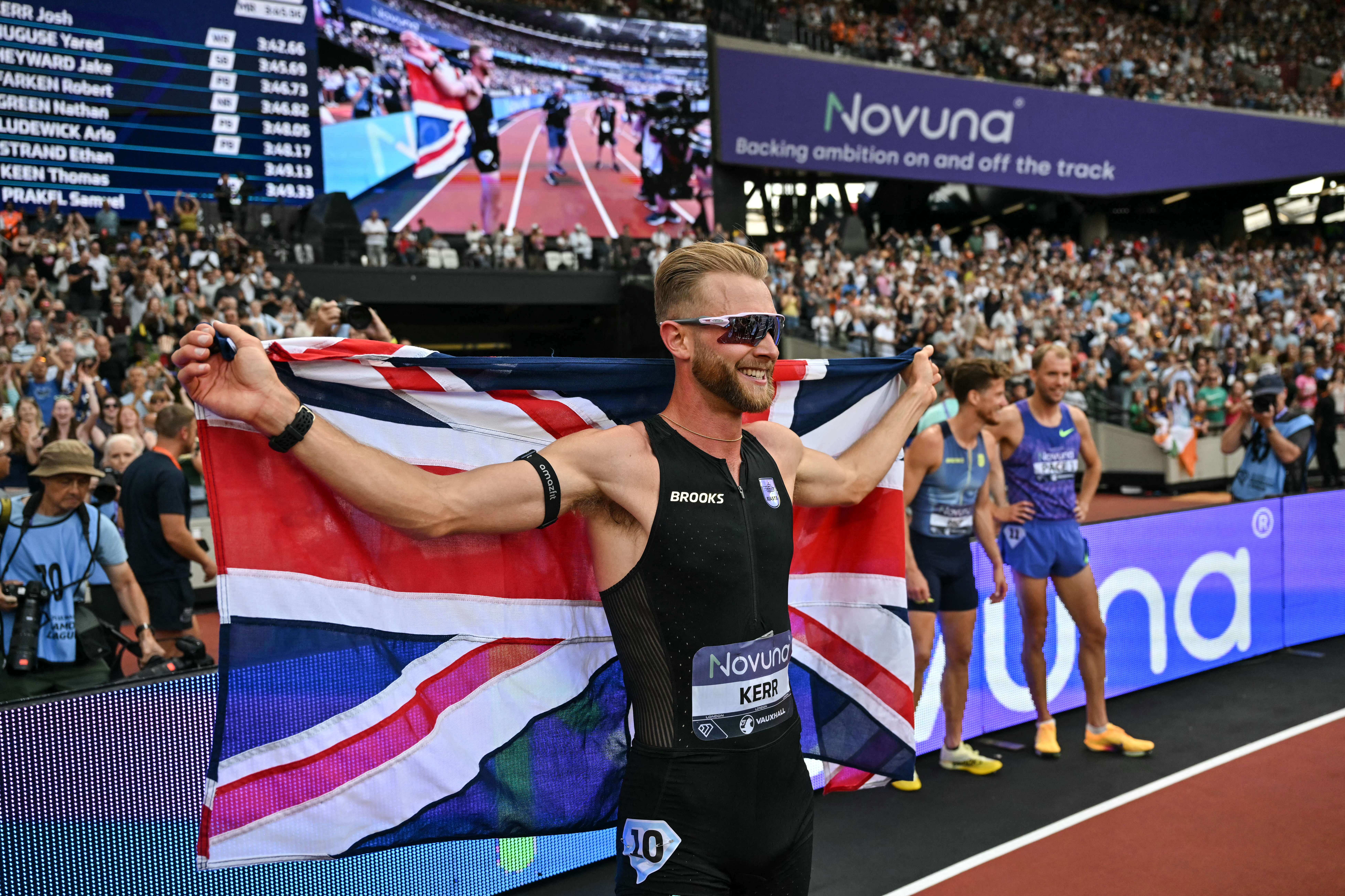 Britain's Josh Kerr celebrates after winning the men's one mile event during the IAAF Diamond League athletics competition at the London stadium in London on July 18, 2026. (Photo by Glyn KIRK / AFP)