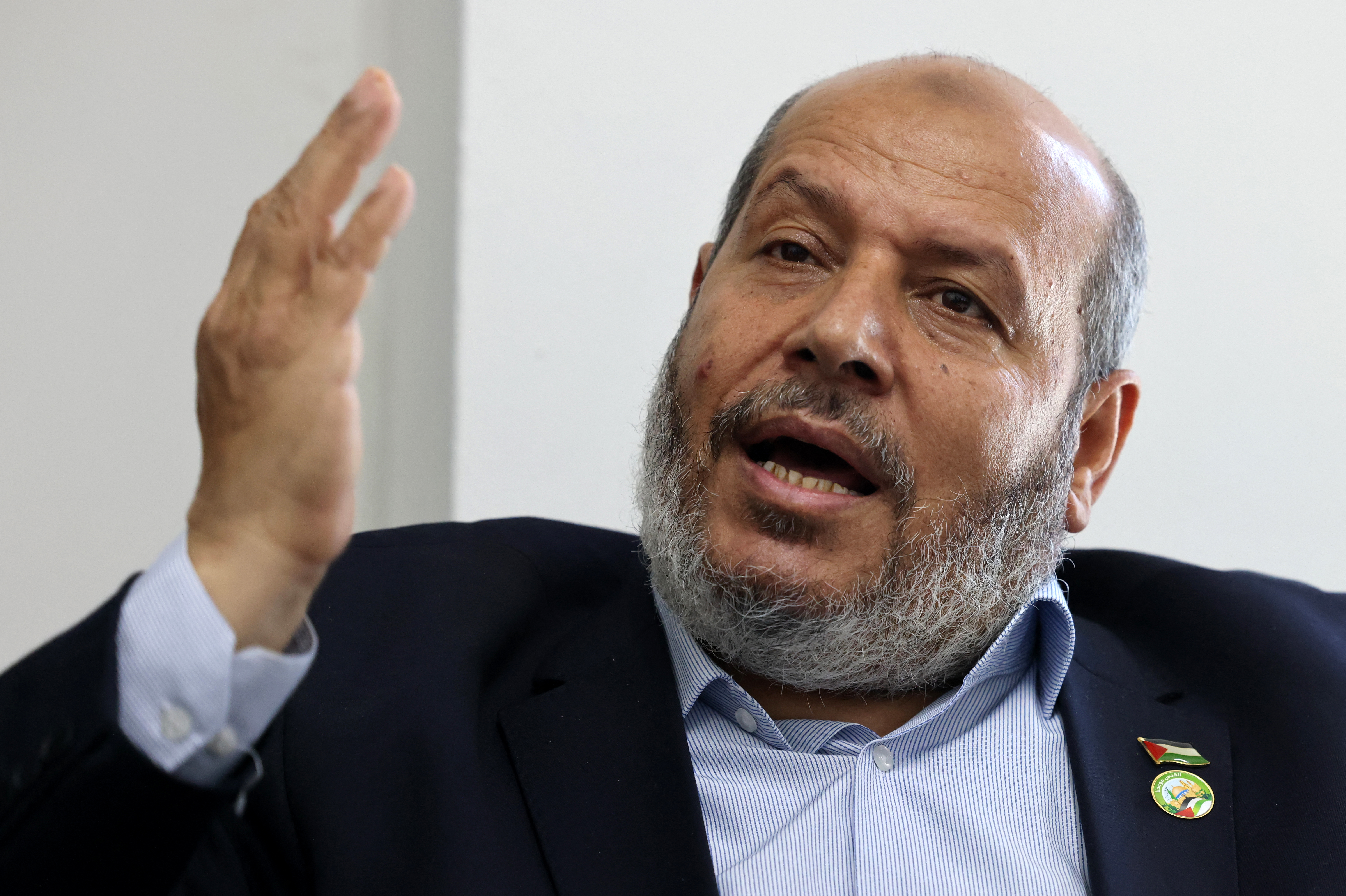(FILES) Khalil al-Hayya, senior leader and top Hamas legislative candidate, gestures duringan interview with AFP at his office in Gaza City on April 21, 2021.