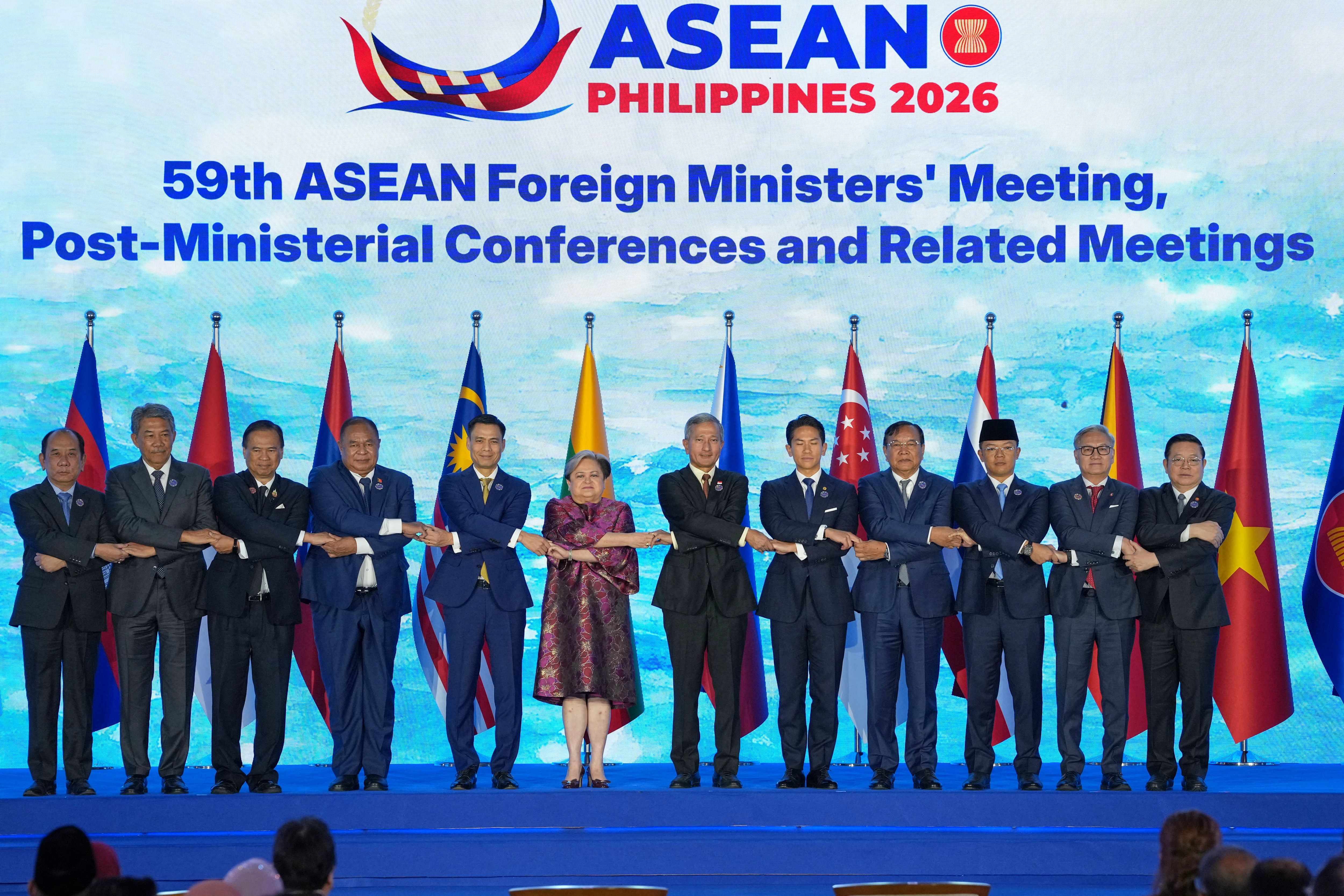 Top diplomats pose for a group photo during the opening ceremony of the ASEAN foreign ministers' meeting in Manila, Philippines