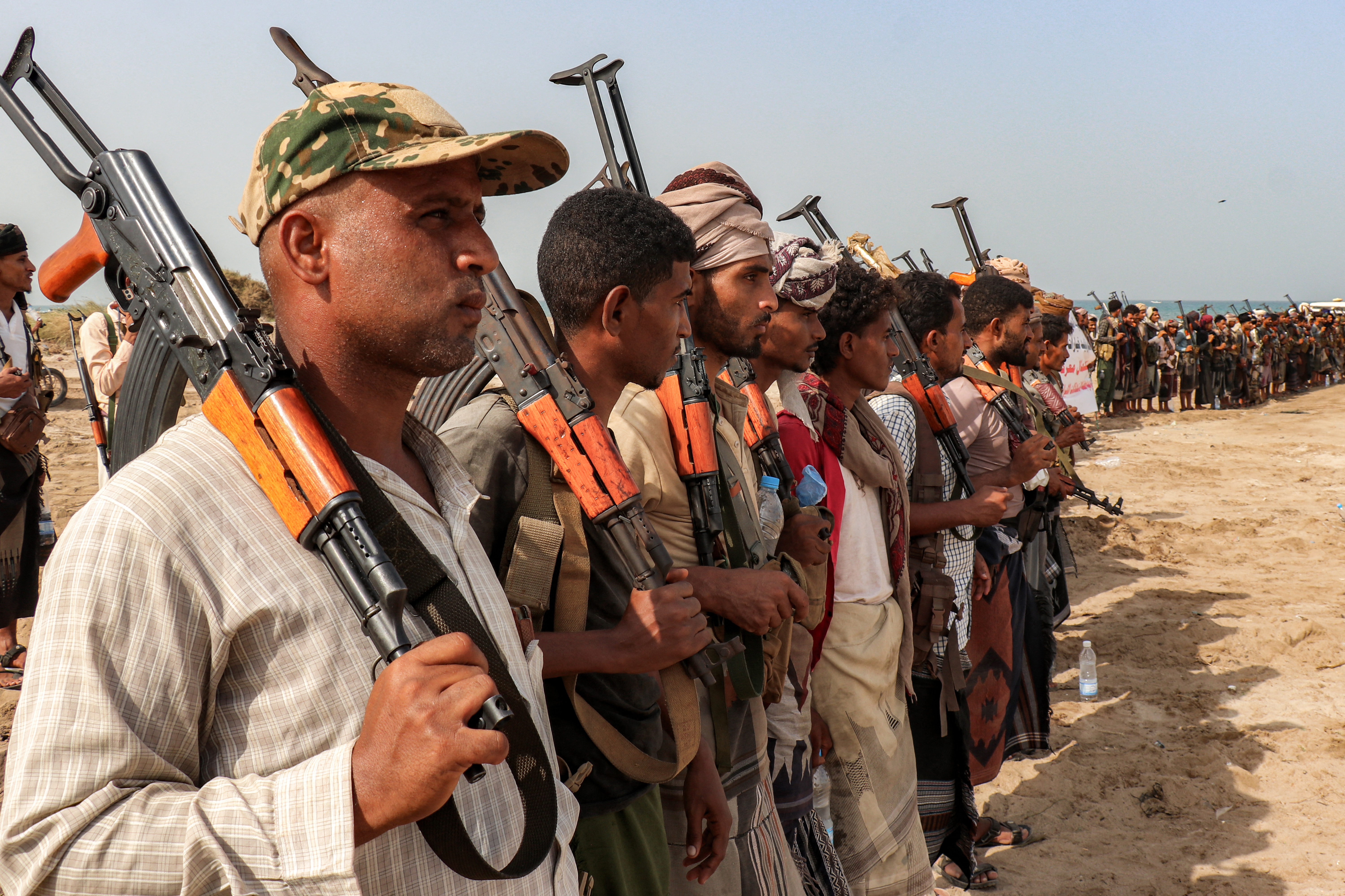 Fighters supporting the Aden-based internationally-recognised Yemeni government gather during a vigil along the Red Sea shore in Khokha, in Yemen's western Hodeidah province on July 20, 2026, calling for a resumption of hostilities with the Huthi group currently controlling the capital Sanaa.