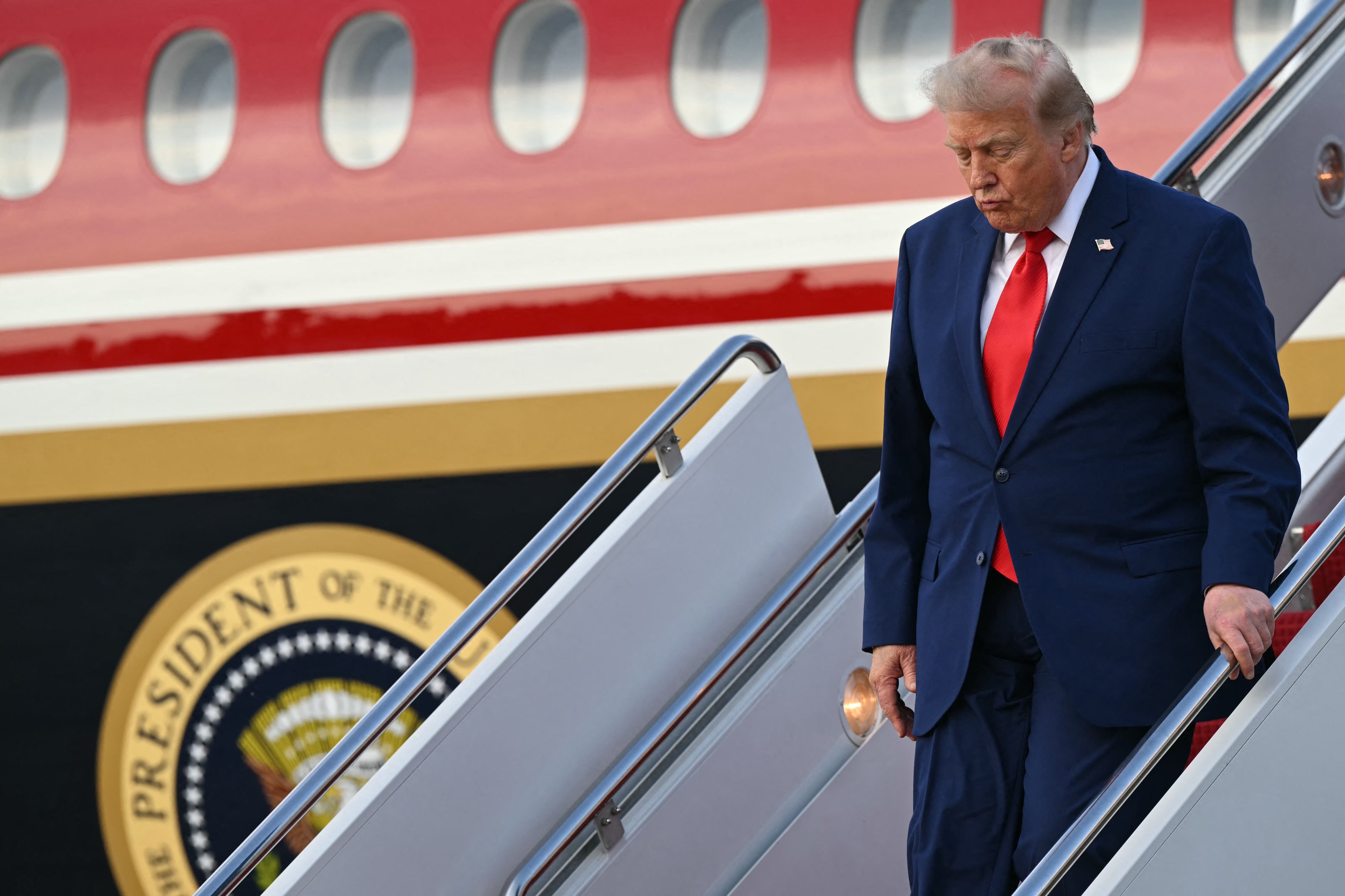 US President Donald Trump steps off Air Force One at Joint Base Andrews in Maryland on July 22, 2026.