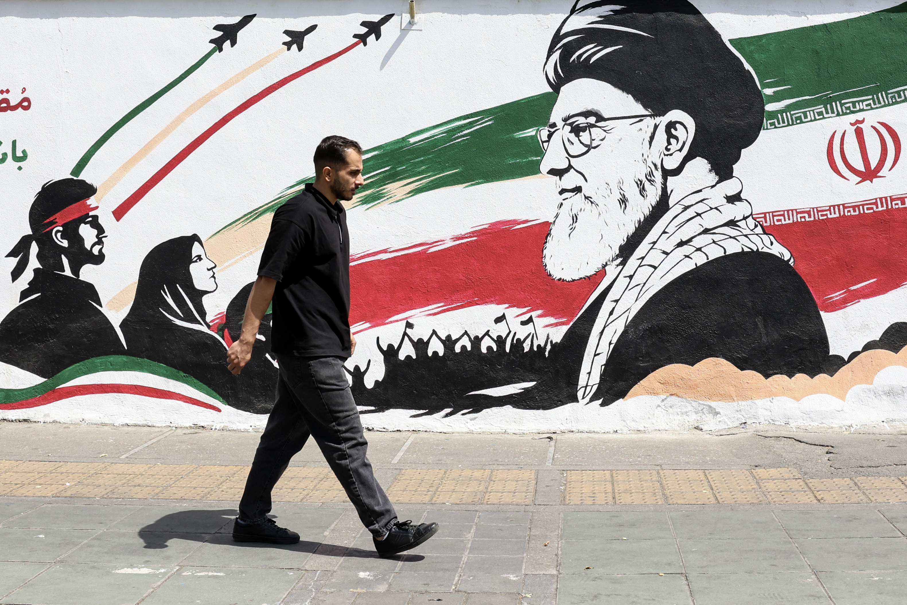 A man walks on a street