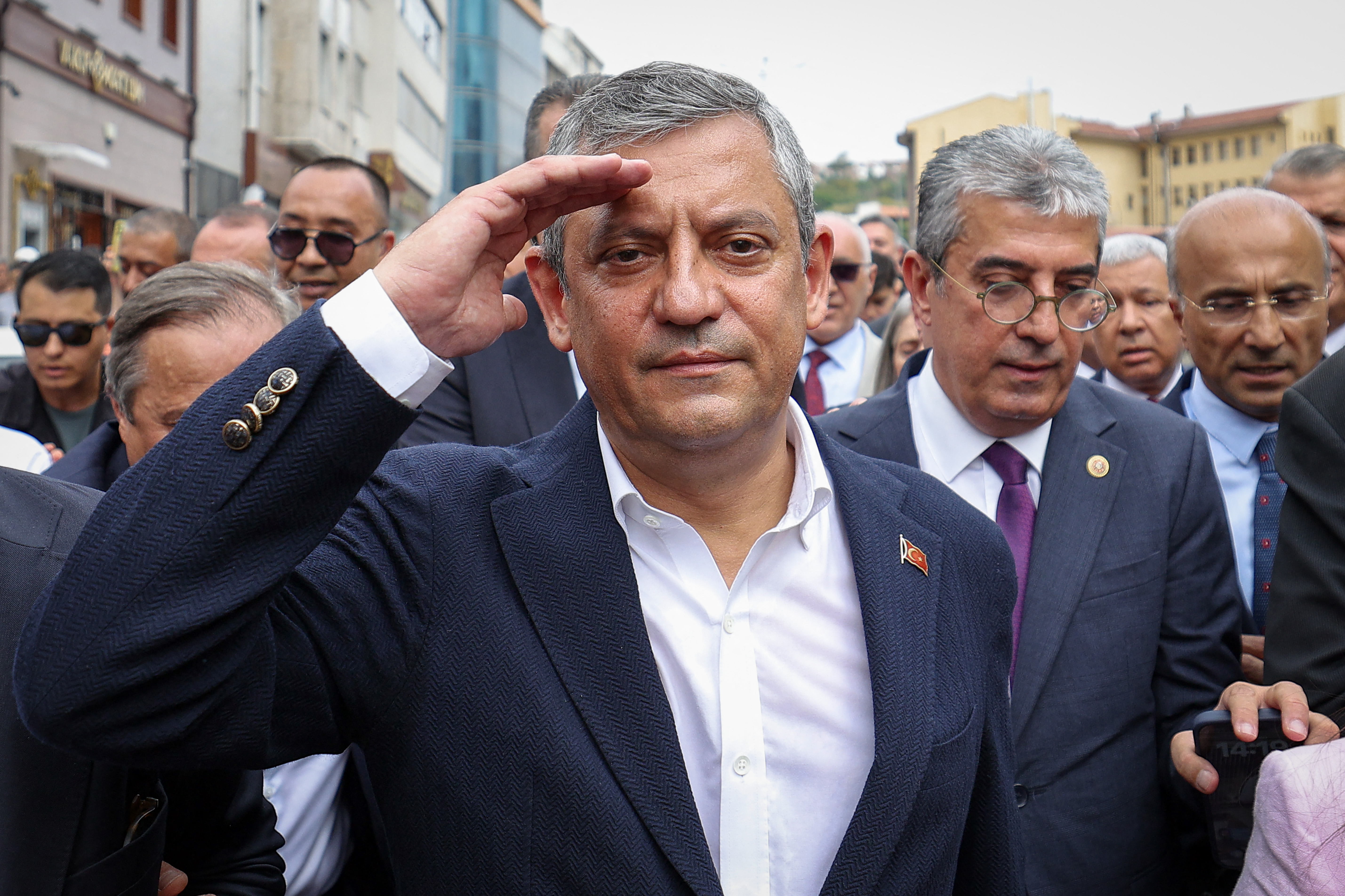 This handout photograph taken and released by the Yeni Party (New Party) press office on July 24, 2026, shows the leader of the Yeni Party (New Party) Ozgür Ozel waving to his supporters after a friday prayer at Haci Bayram mosque in Ankara.