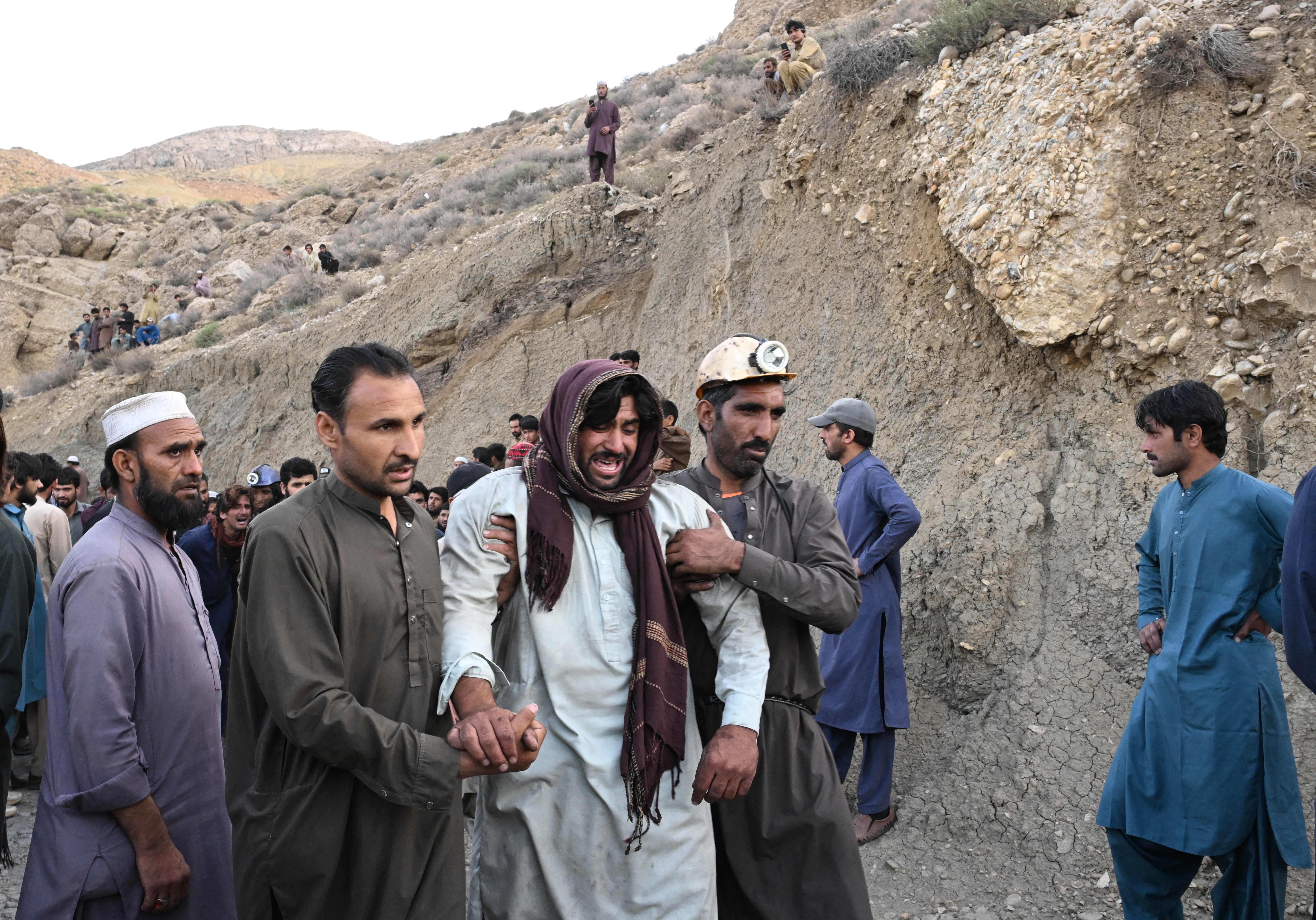 A coal miner grieves after a coal mine collapse in the Surange area, some 50 kilometres east of Quetta, on July 30, 2026.