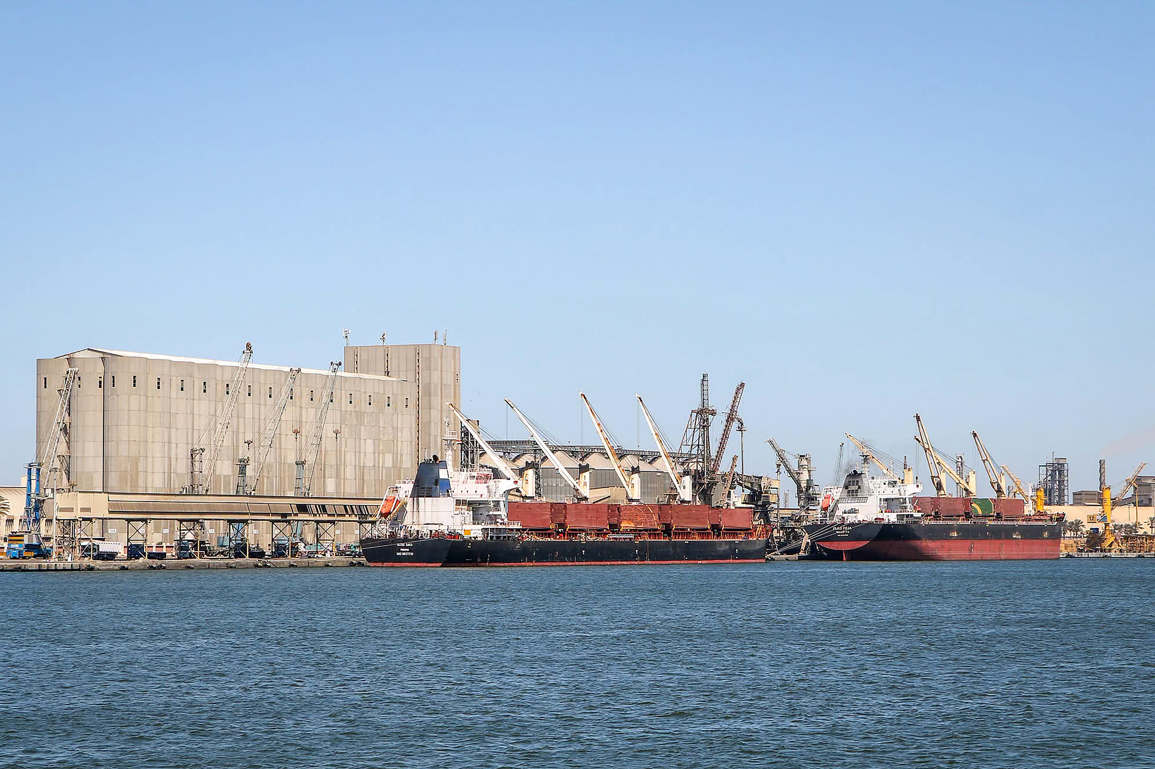 TOPSHOT - This handout photograph taken and released by the Damietta Port Authority on July 30, 2026 shows ships docked on the wharf of the Mediterranean sea port of Damietta.
