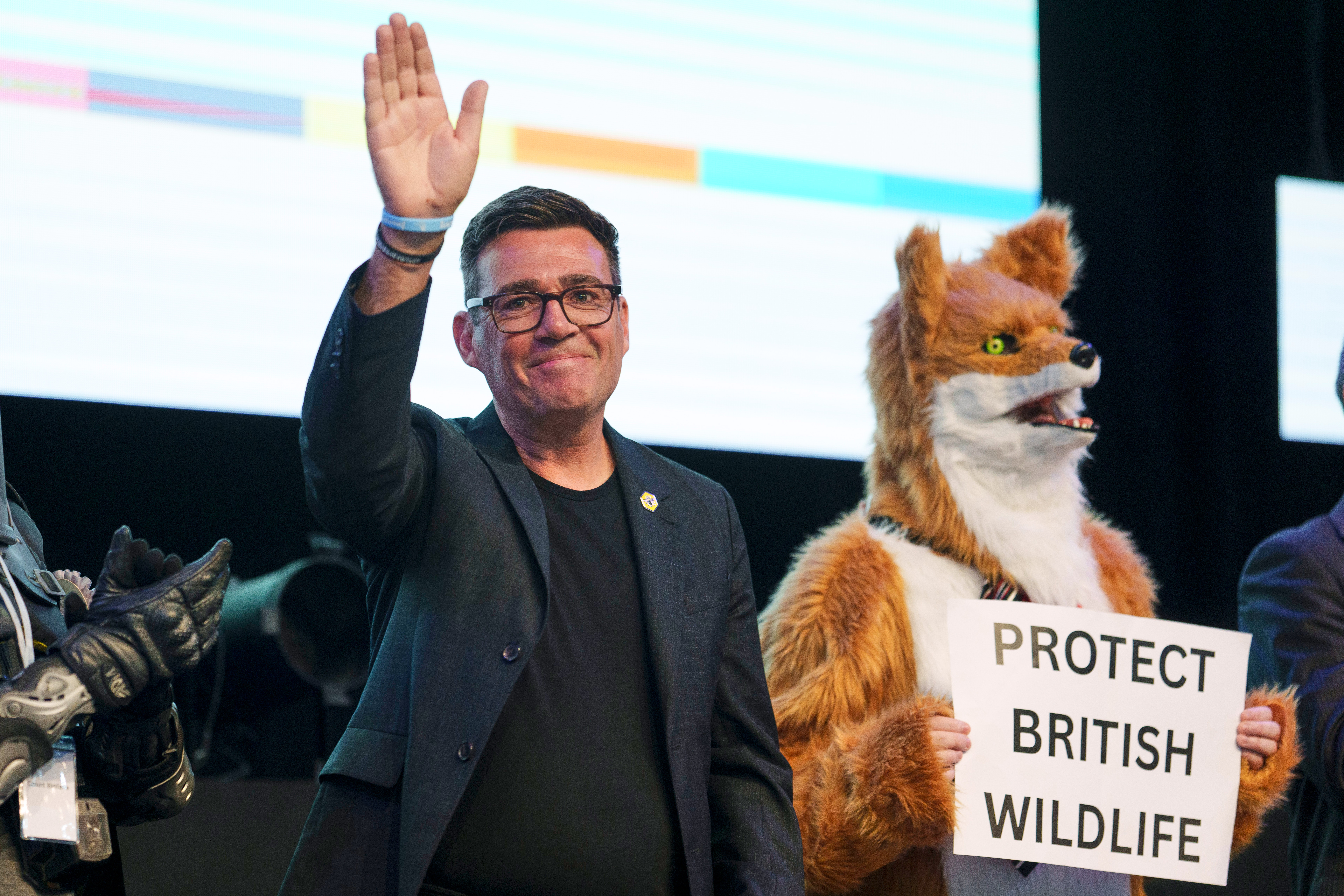 Labour party's Andy Burnham stands beside a candidate for Protect British Wildlife as he waves after winning the Makerfield by-election, paving the way for a leadership challenge against Prime Minister Sir Keir Starmer. in Wigan, England, Friday, June 19, 2026.(AP Photo/Jon Super)
