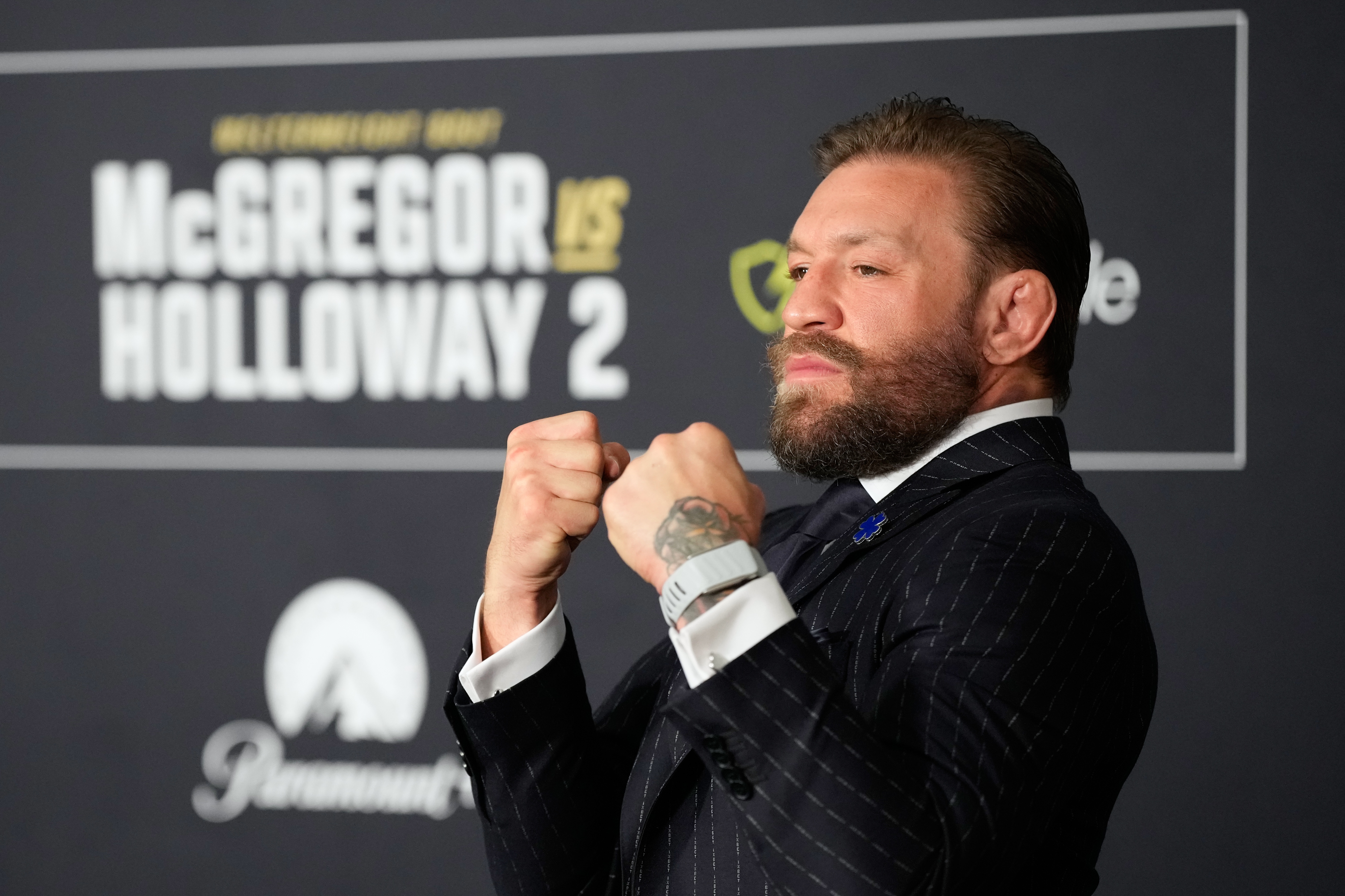 Conor McGregor poses during a news conference.