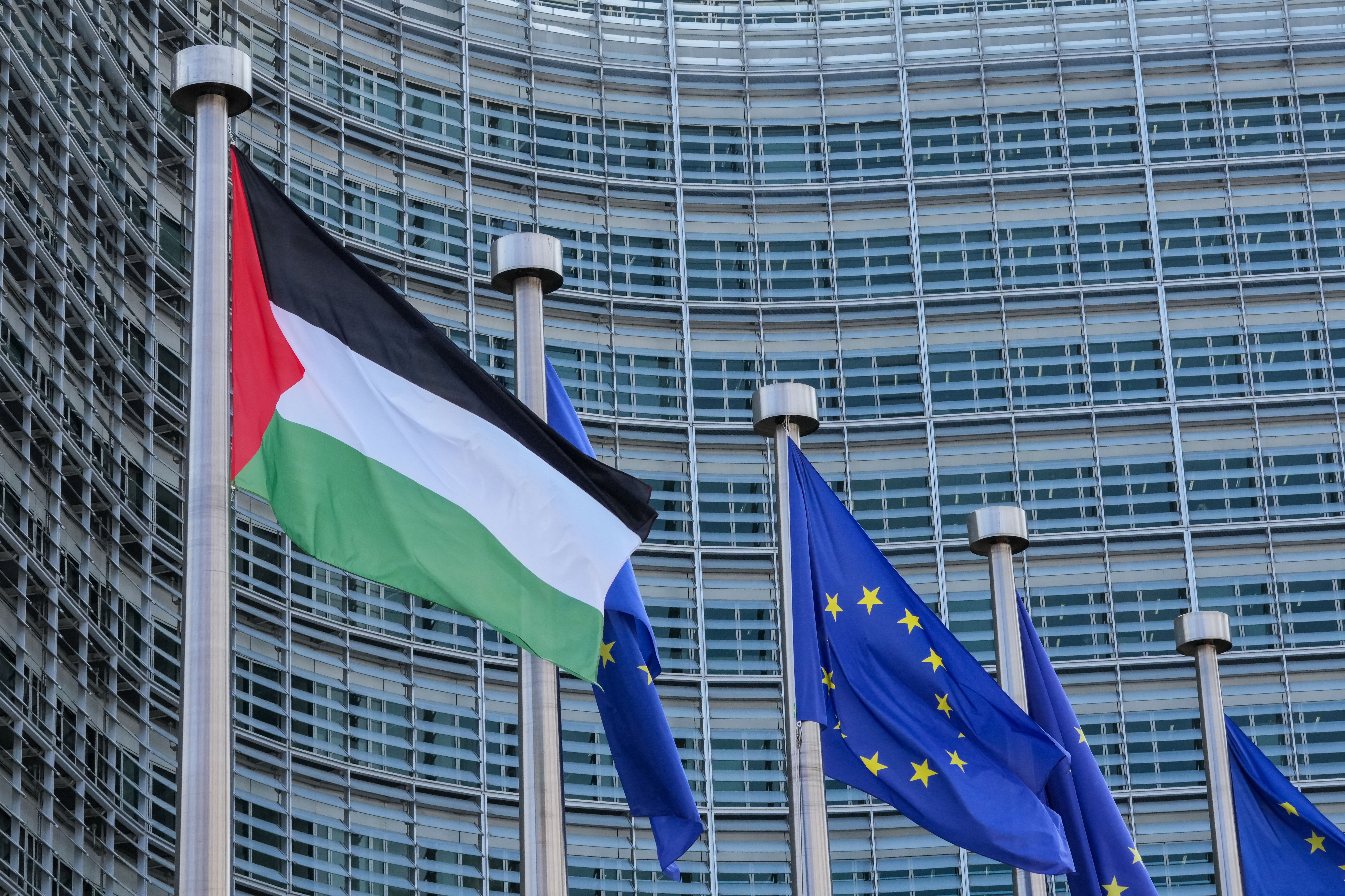 The Palestinian and EU flags flap in the wind outside EU headquarters prior to a Palestinian Donors Conference in Brussels, Monday, July 13, 2026. (AP Photo/Marius Burgelman)