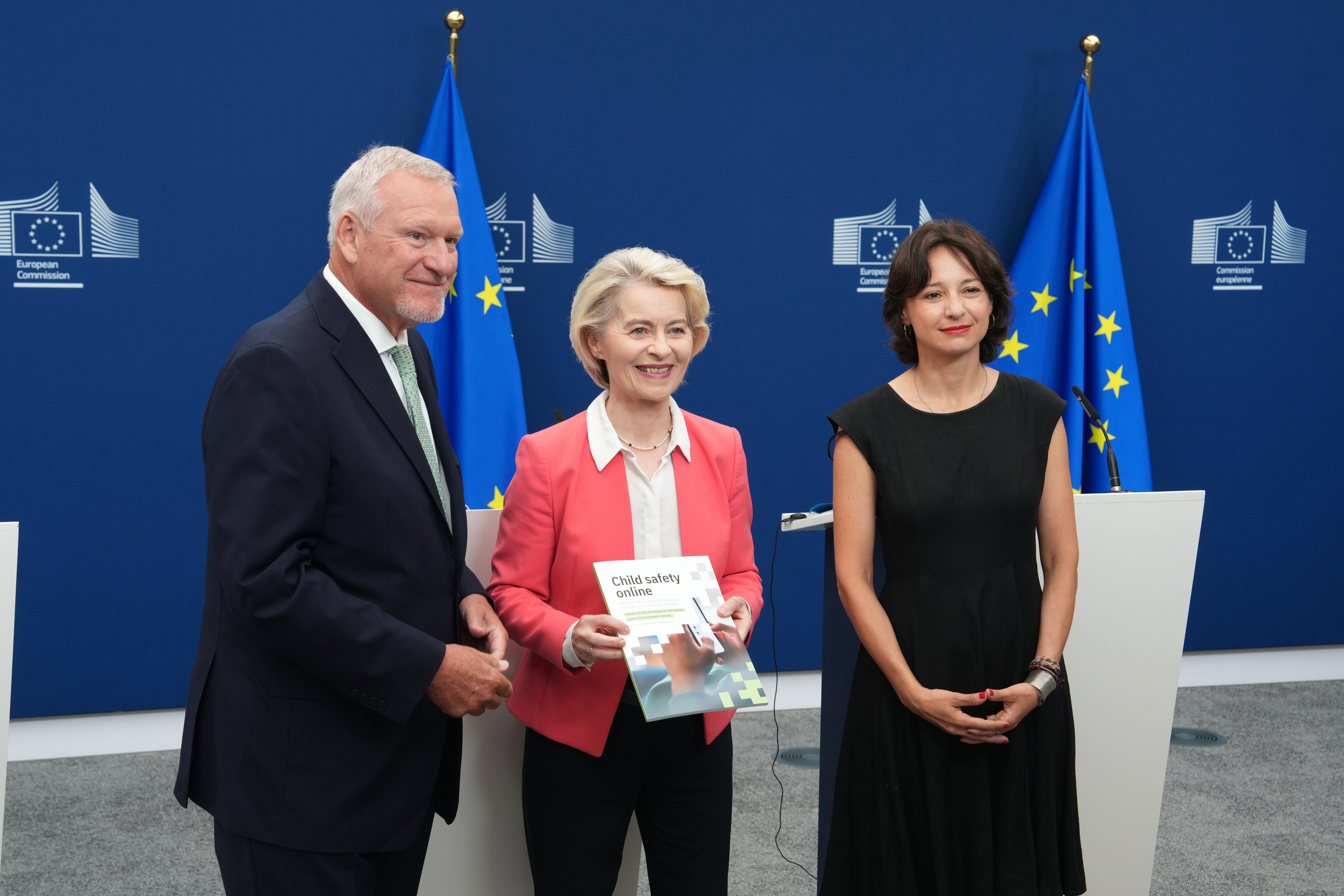 European Commission President Ursula von der Leyen, center, poses with co-chairs of the Special Panel Maria Melchior, right, and Jörg M. Fegert during a report on children's safety online at EU headquarters in Brussels, Monday, July 13, 2026. (AP Photo/Marius Burgelman)