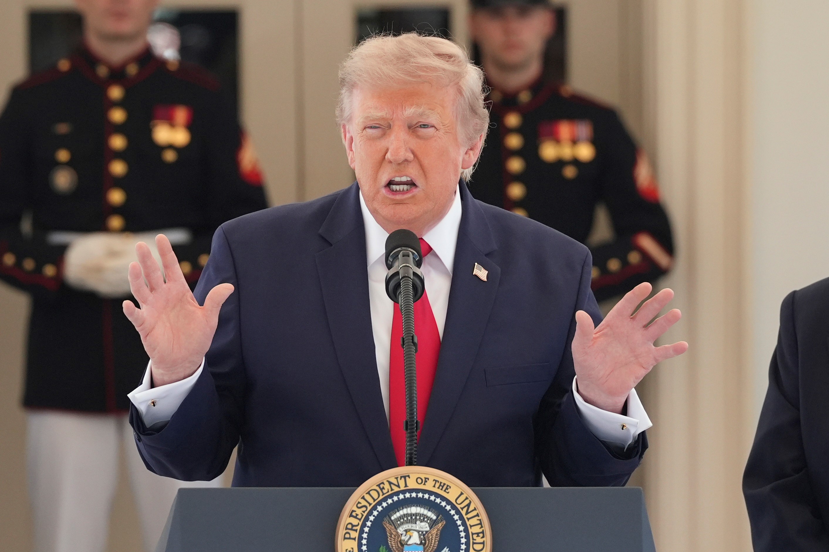 President Donald Trump speaks on West Executive Drive at the White House during a showcase for the upcoming Freedom 250 Grand Prix auto race, Monday, July 13, 2026, in Washington. (AP Photo/Alex Brandon)