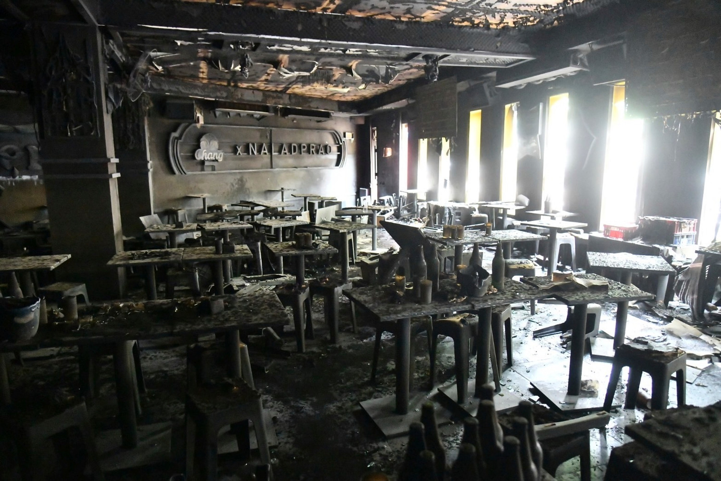 In this handout photo released by Bangkok Metropolitan Administration, the interior of a beer bar is seen after a fire in Bangkok, Thailand, Monday, July 13, 2026. (Bangkok Metropolitan Administration via AP)