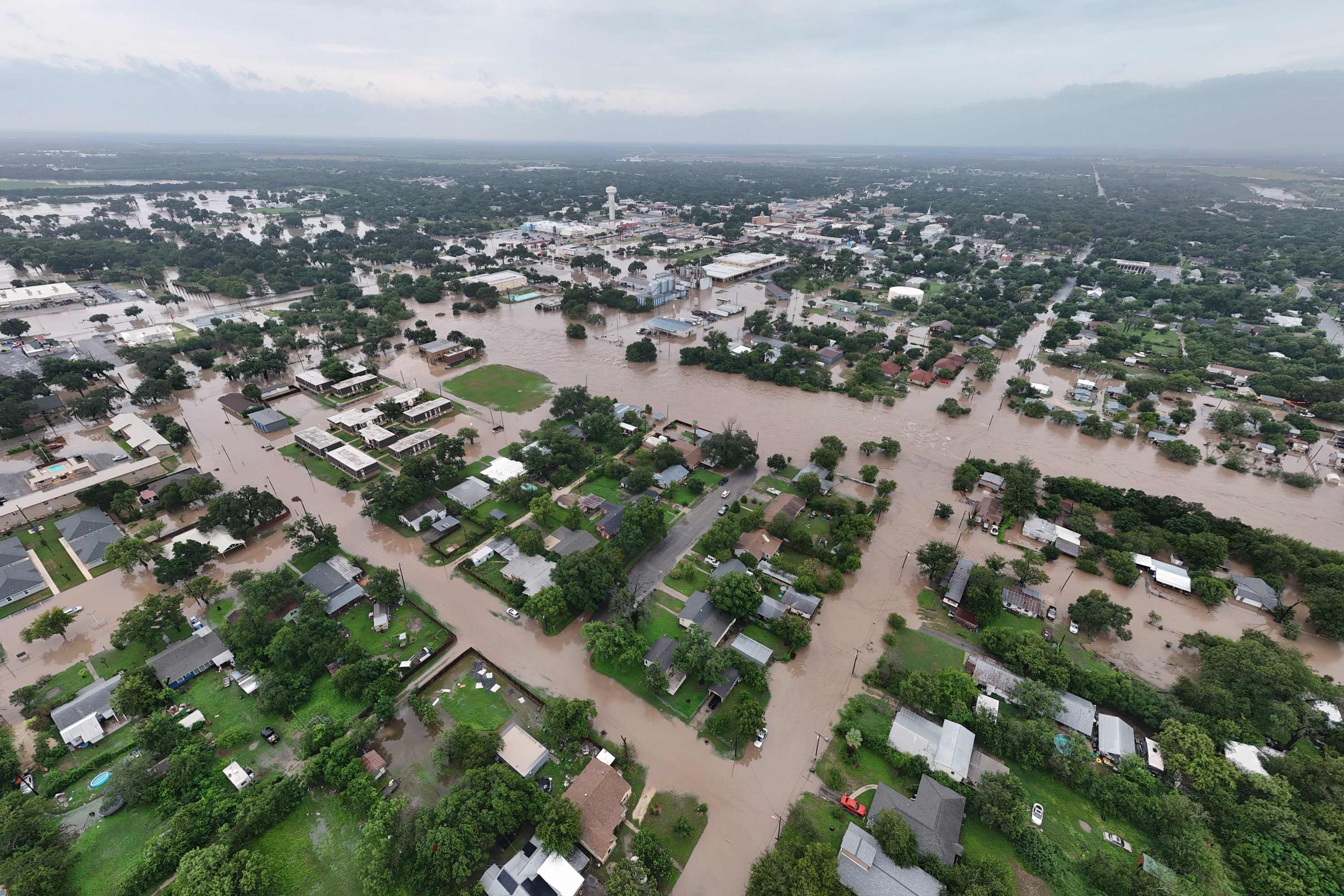 This aerial photo provided by David Fry shows flooding in Uvalde, Texas, on Thursday, July 16, 2026. (David Fry/Medina Real Estate Photography via AP)