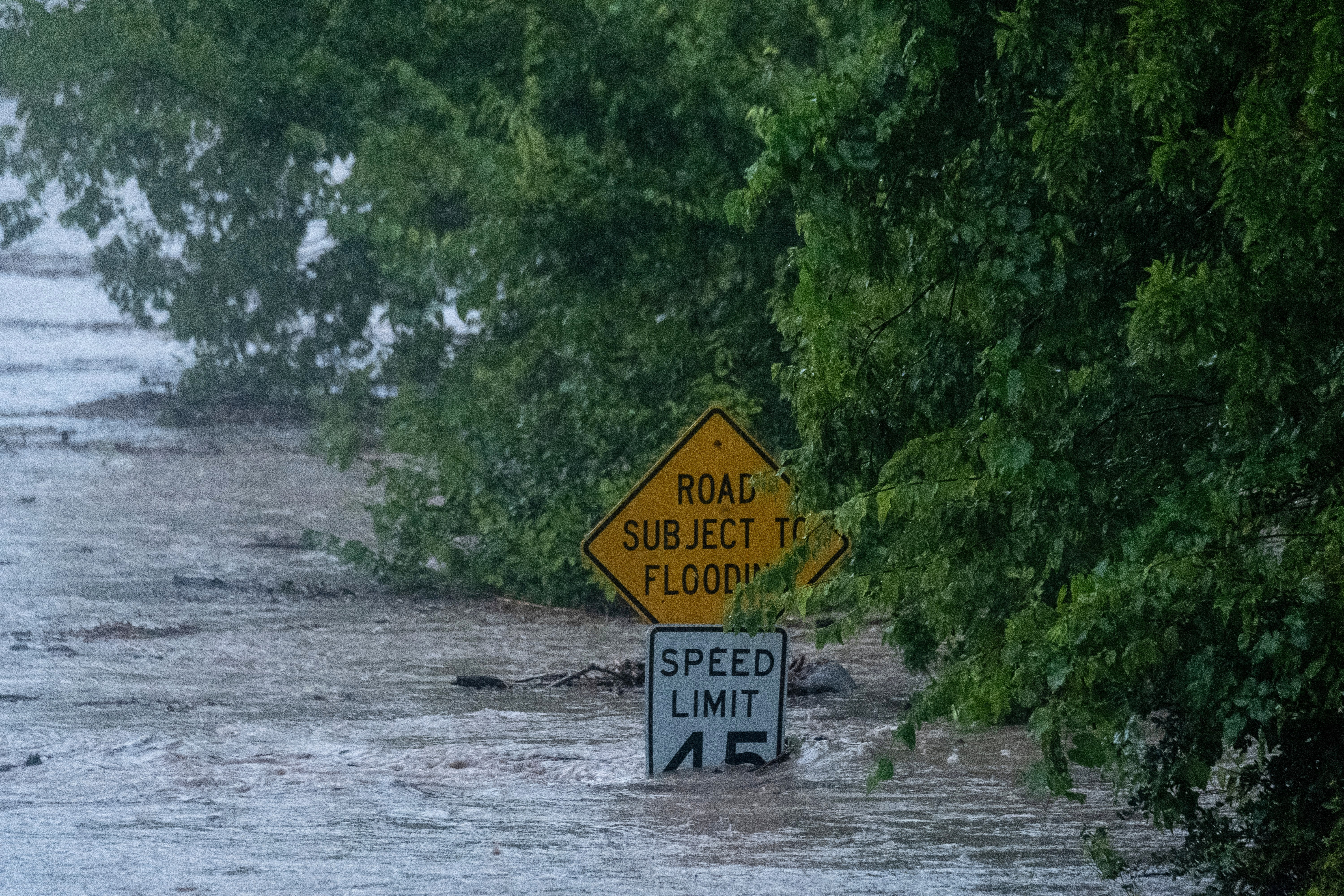 The Pedernales River floods along State Highway 16 on Thursday, July 16, 2026, in Fredericksburg, Texas. (AP Photo/Joel Angel Juarez)