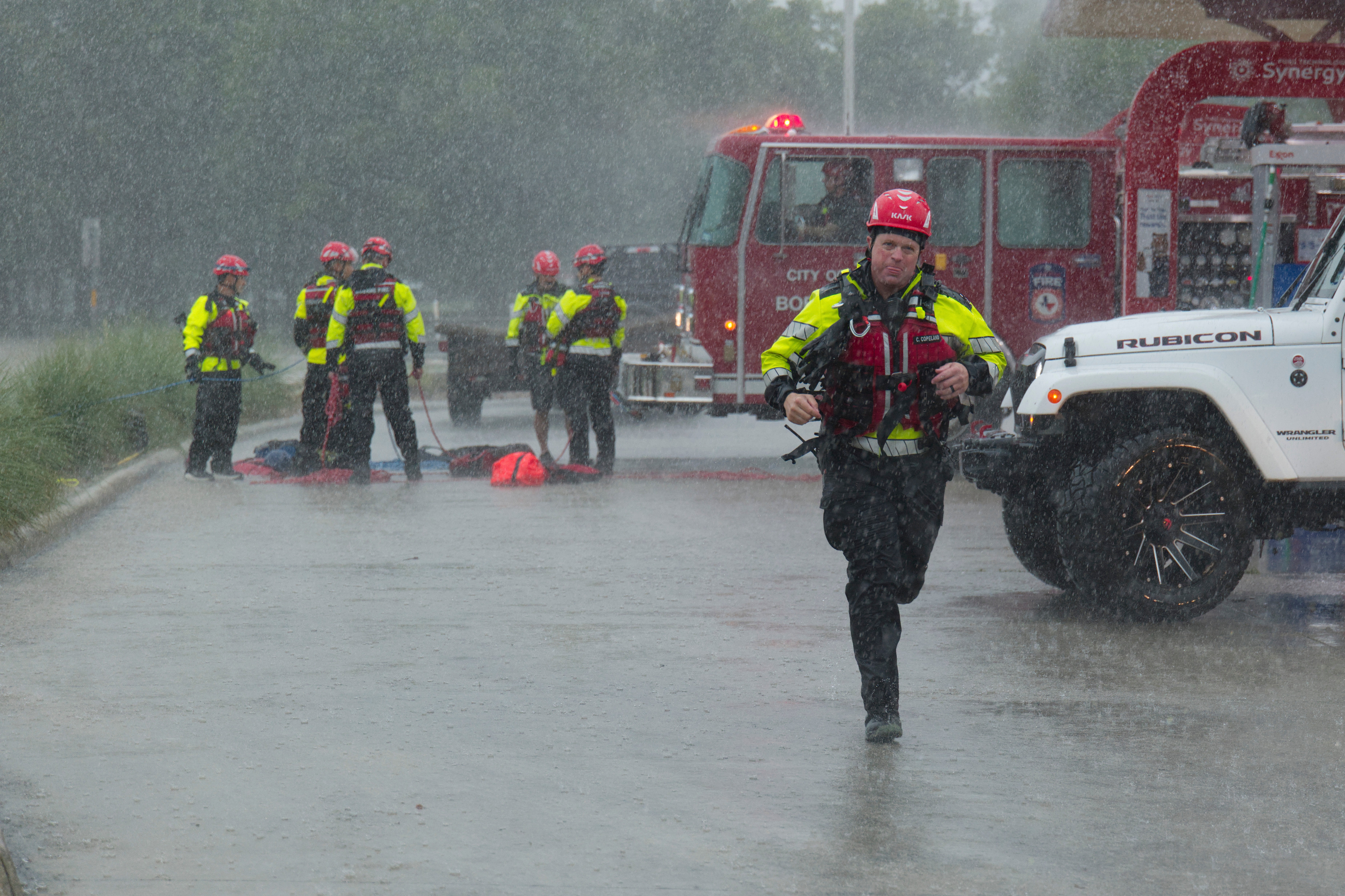 Members of the Boerne Fire Dept. prepare to perform a water rescue on Wednesday, July 15, 2026, in Boerne, Texas. (AP Photo/Darren Abate)