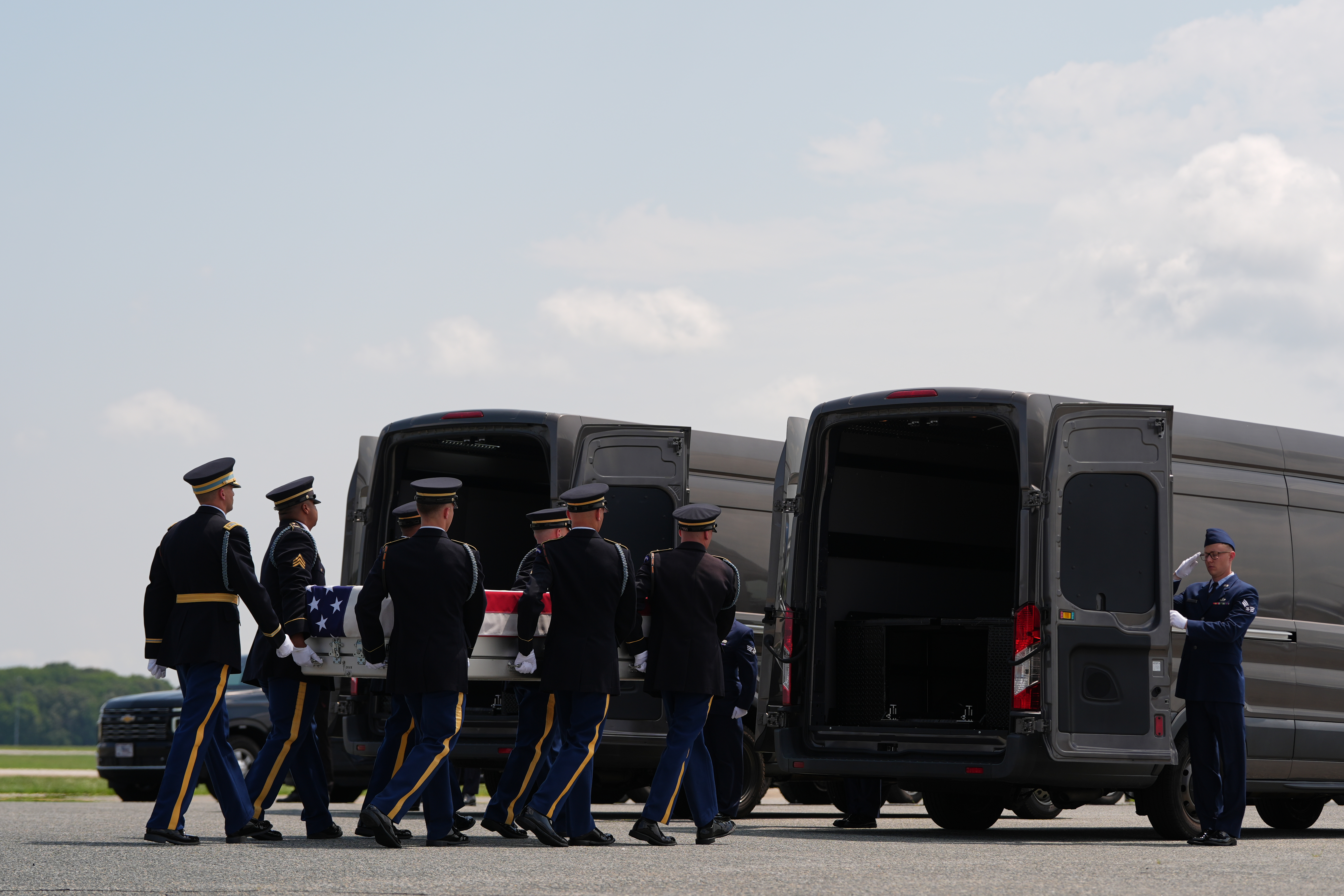 A U.S. Army carry team moves a transfer case containing the remains of 1st Lt. Tyler James Feehan of Ewa Beach, Hawaii, into a transfer vehicle Wednesday, July 22, 2026, at Dover Air Force Base, Del. (AP Photo/Julia Demaree Nikhinson)