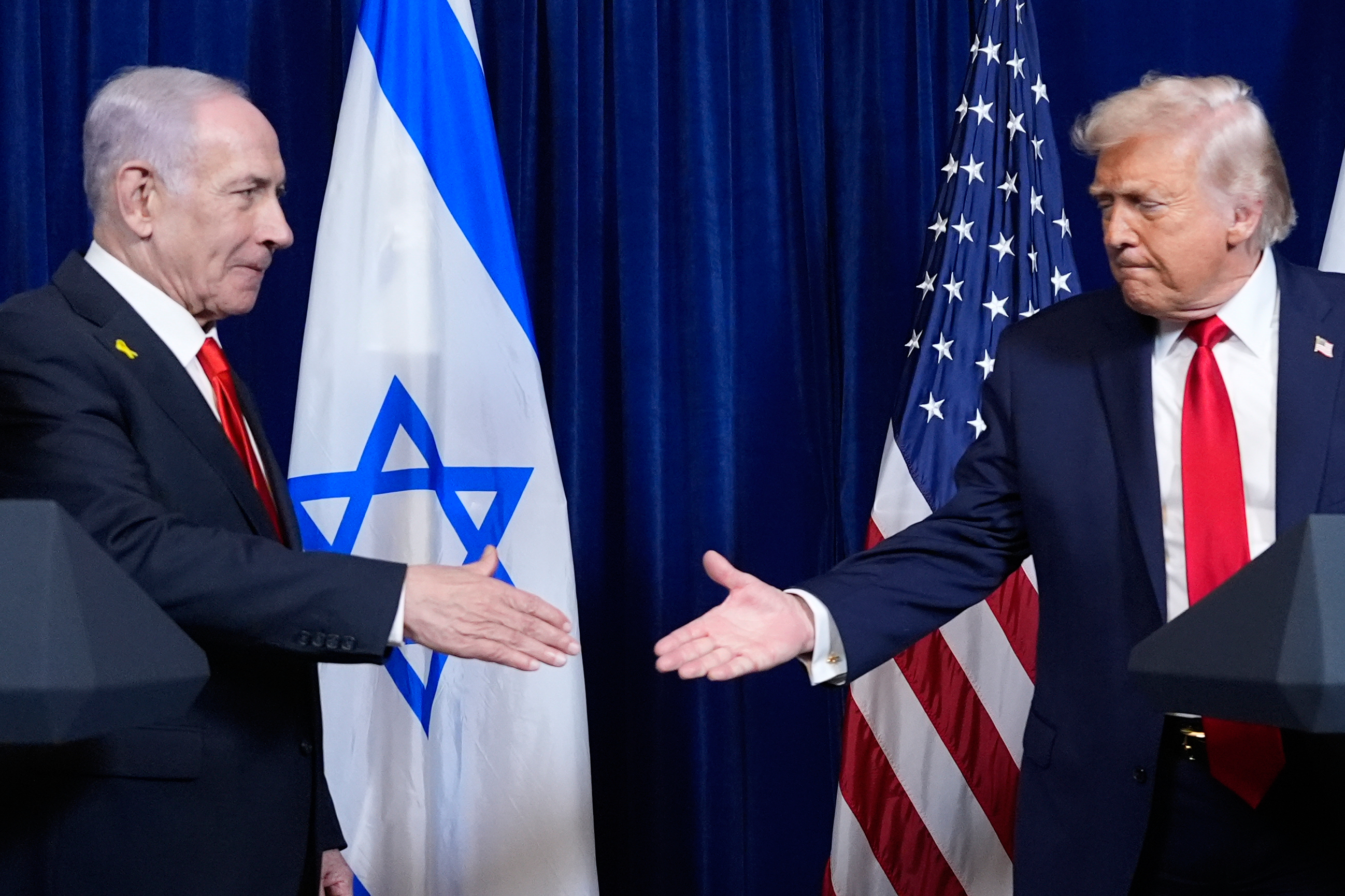 FILE - President Donald Trump shakes hands with Israel's Prime Minister Benjamin Netanyahu at the end of a news conference at Mar-a-Lago, Dec. 29, 2025, in Palm Beach, Fla. (AP Photo/Alex Brandon, File)