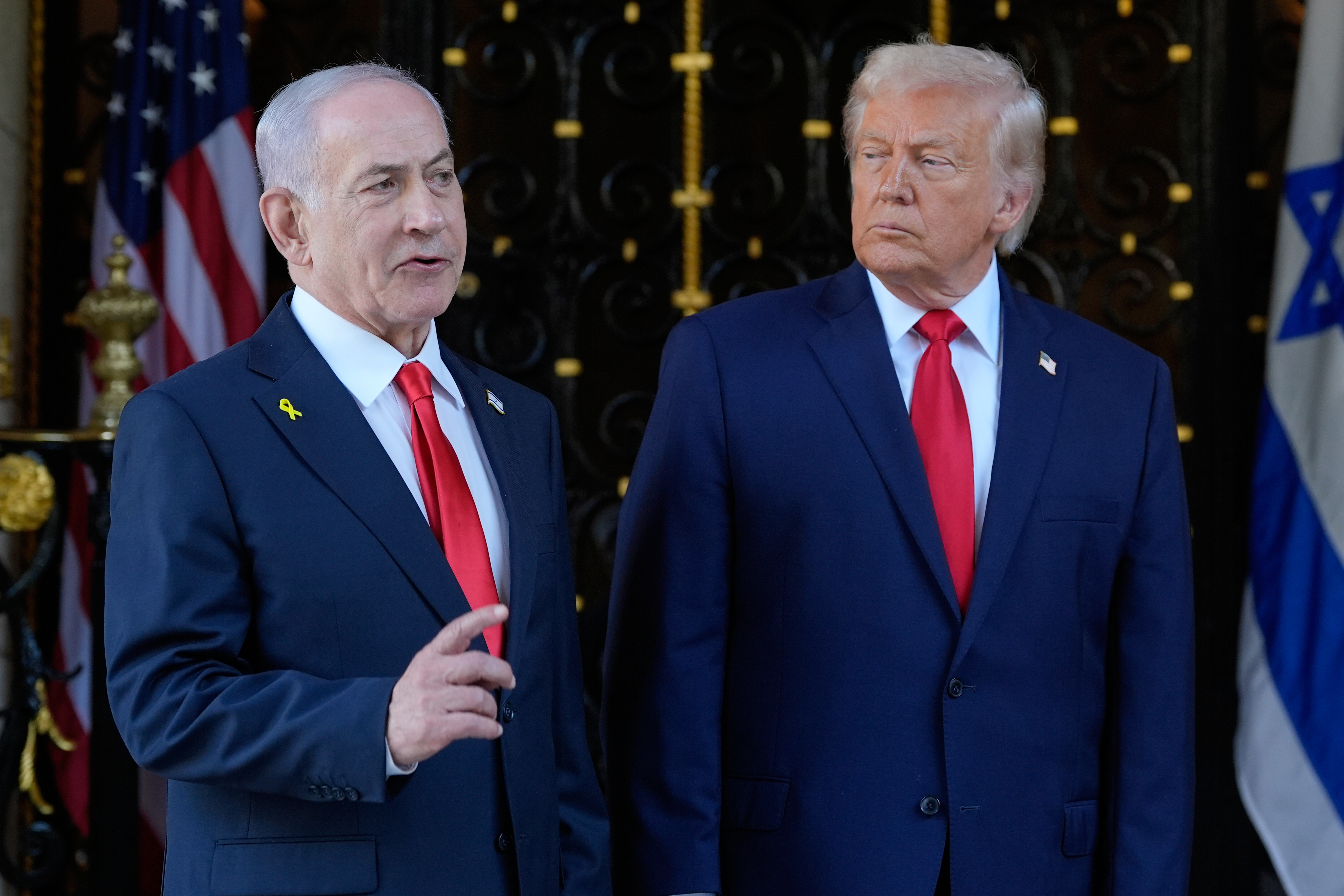 FILE - President Donald Trump listens as Israel's Prime Minister Benjamin Netanyahu speaks at President Donald Trump's Mar-a-Lago club, Dec. 29, 2025, in Palm Beach, Fla. (AP Photo/Alex Brandon, File)