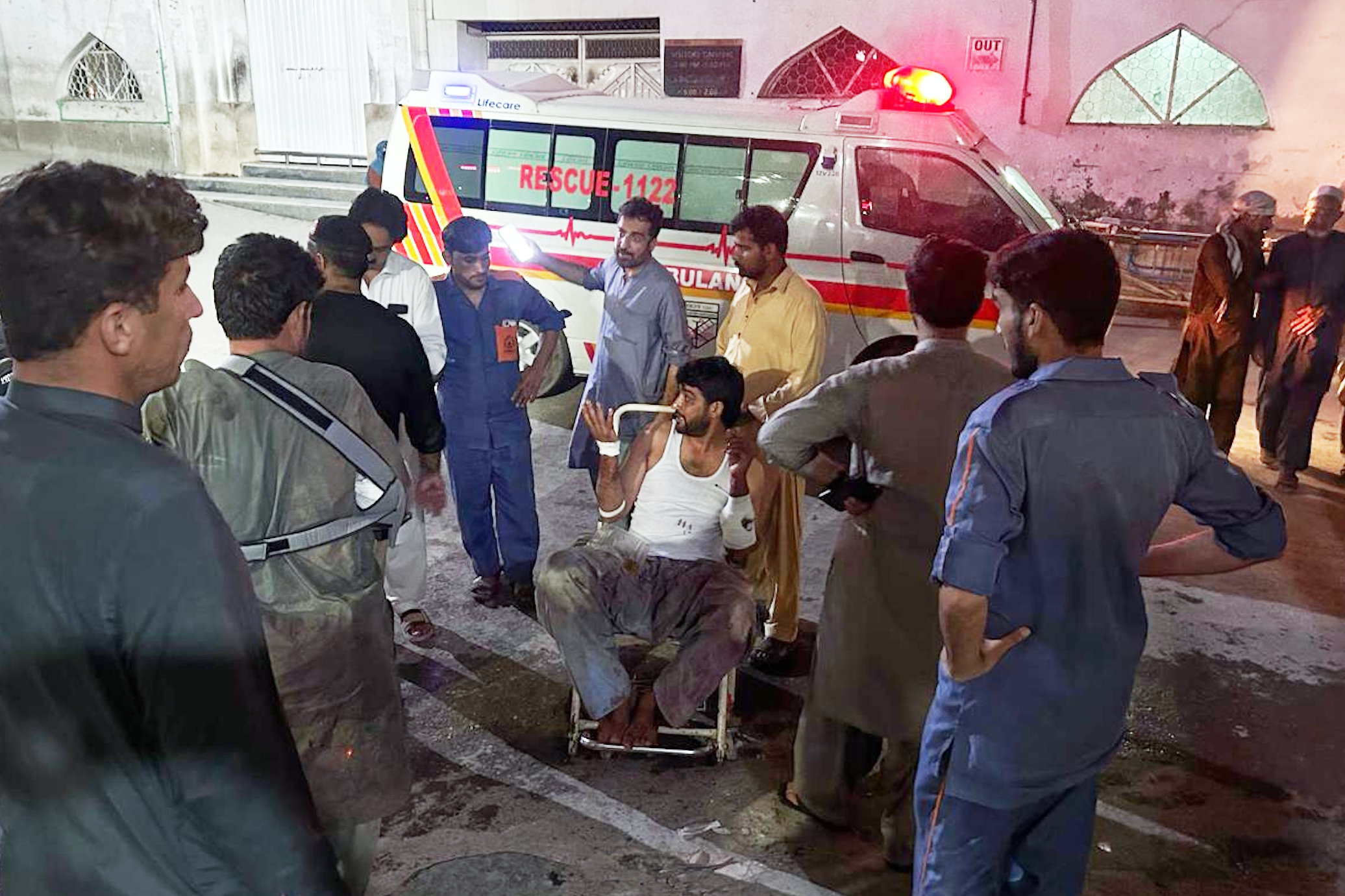 People transport an injured man.