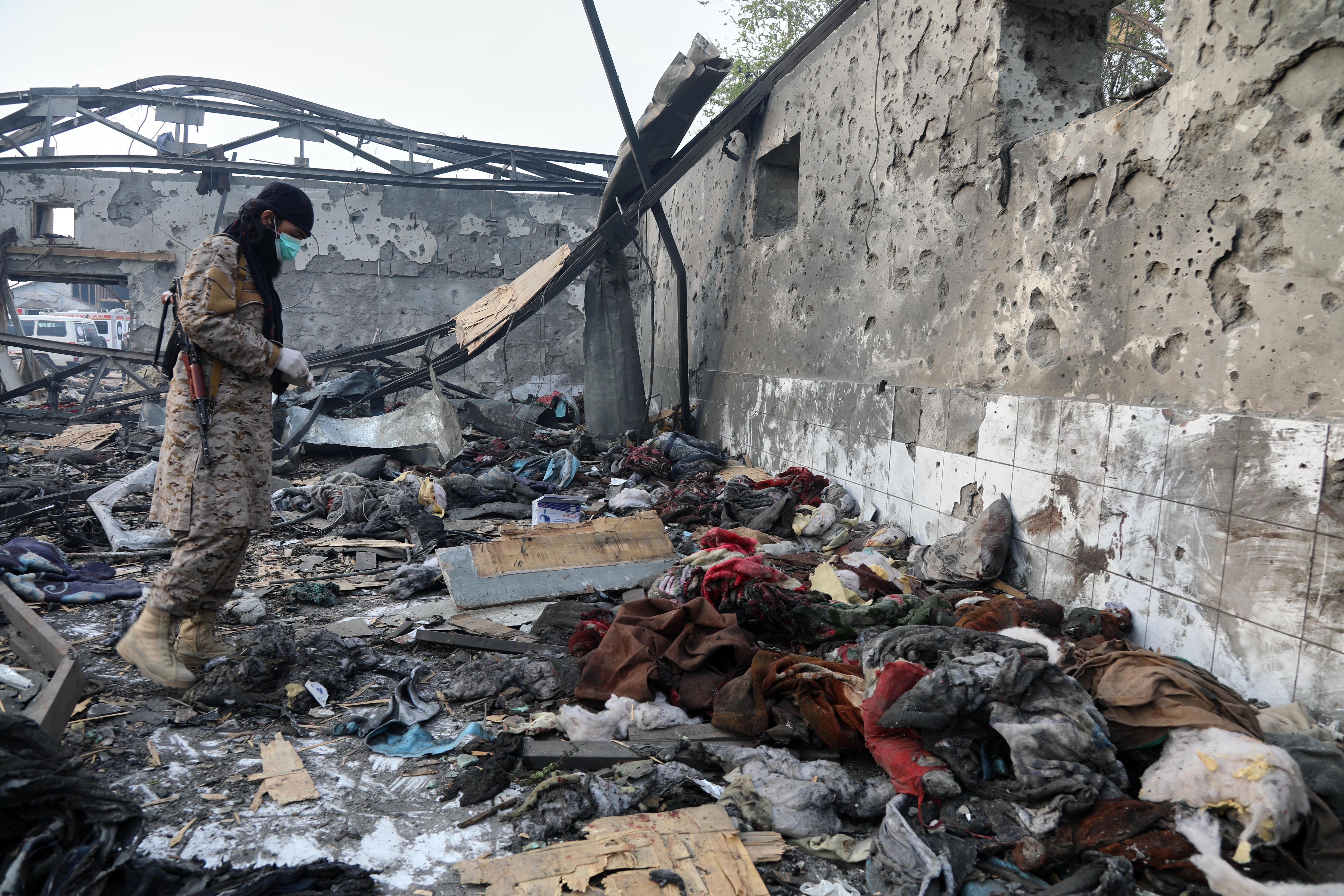 FILE - Taliban rescue team member Allah Mohammad Farooq inspects the site of a late-Monday airstrike at a drug rehabilitation hospital in Kabul, Afghanistan, Tuesday, March 17, 2026. (AP Photo/Siddiqullah Alizai, File)