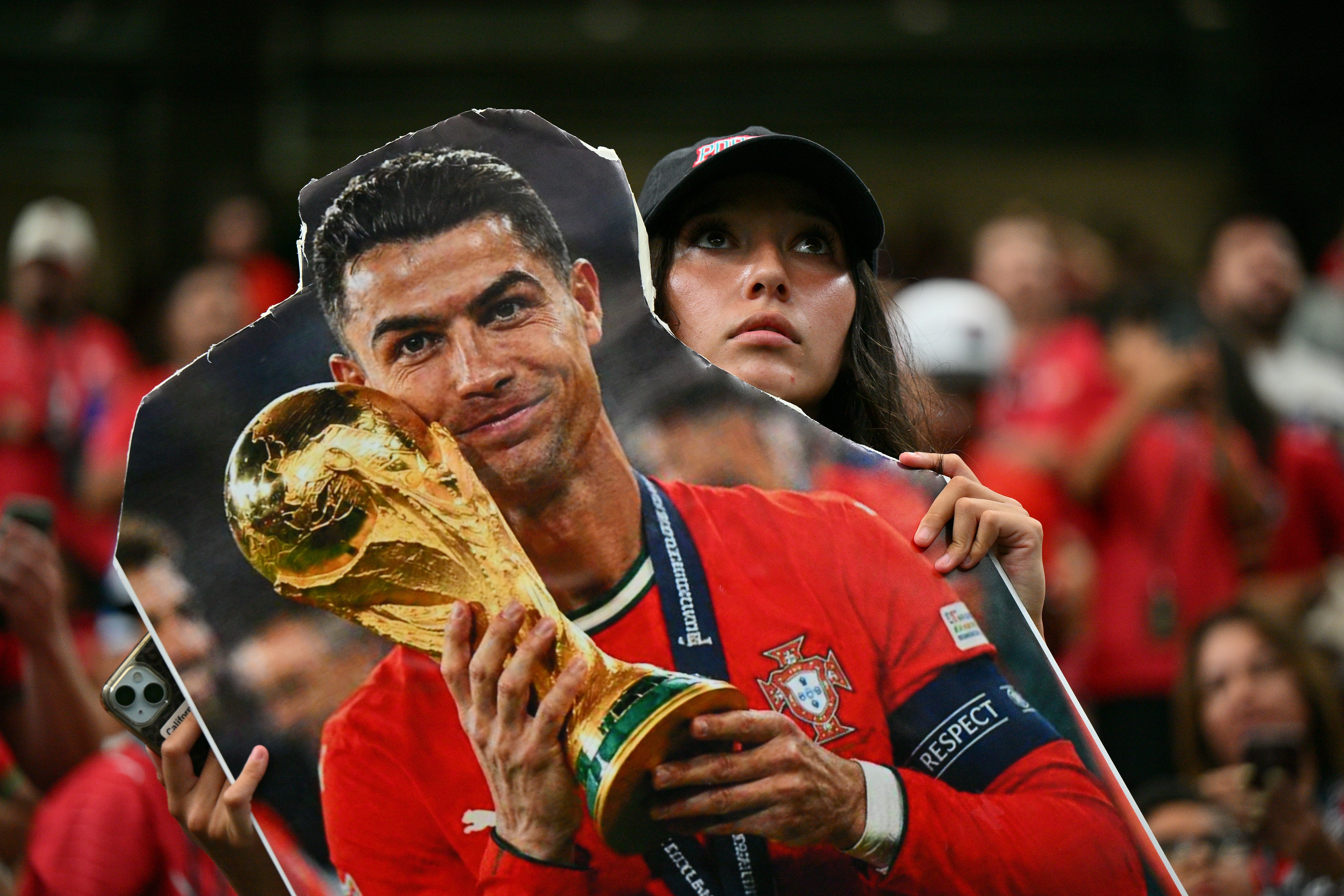 A fan holds a cardboard of Cristiano Ronaldo of Portugal