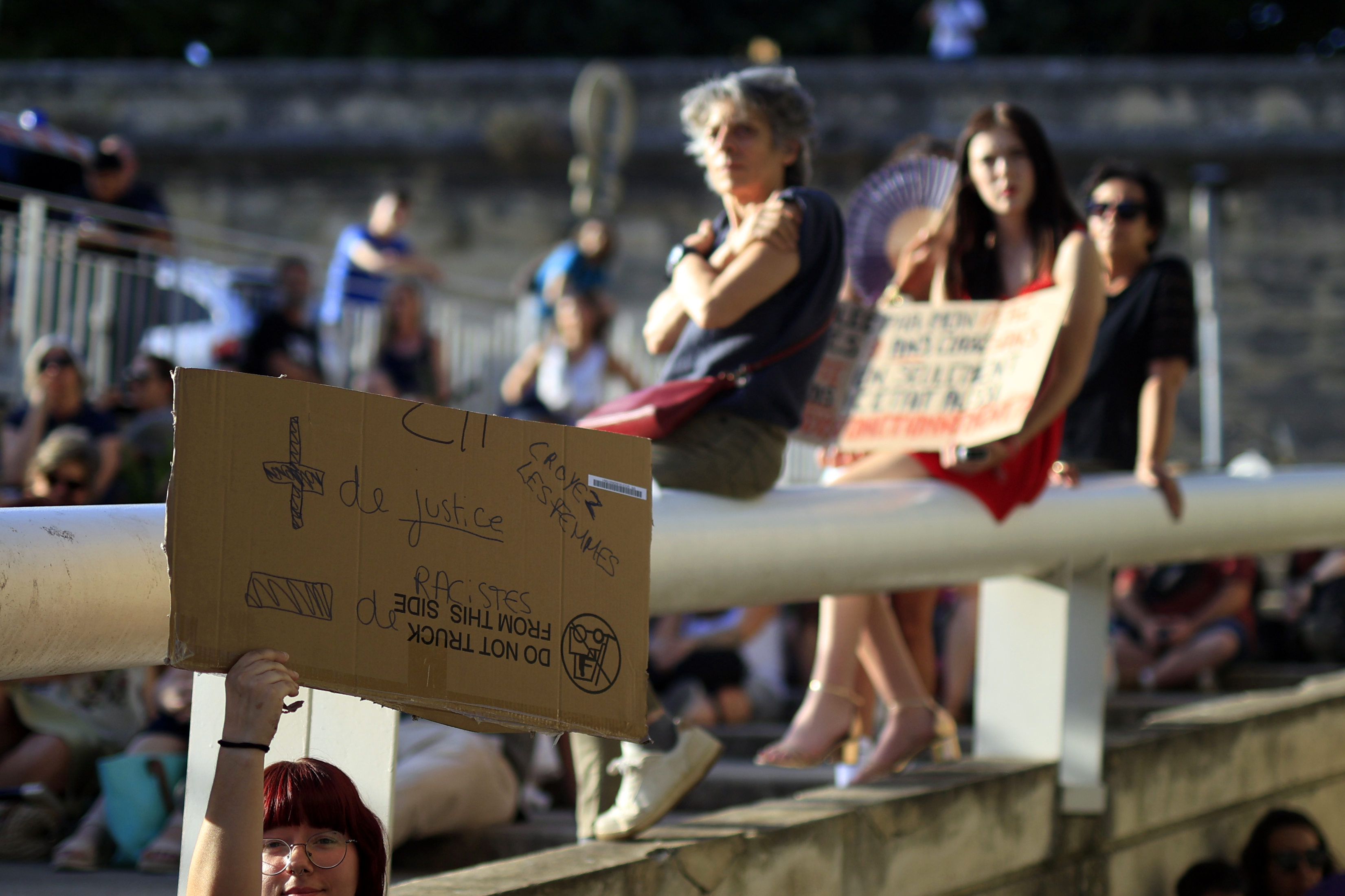 epa13039741 A protester carries a placard reading, “More justice, less racism,” during a demonstration outside the courthouse in Montpellier, southern France, 15 June 2026. Feminist and child advocacy organisations called for protests following the killing of Lyhanna, amid criticism of the handling of the case. EPA/Guillaume Horcajuelo