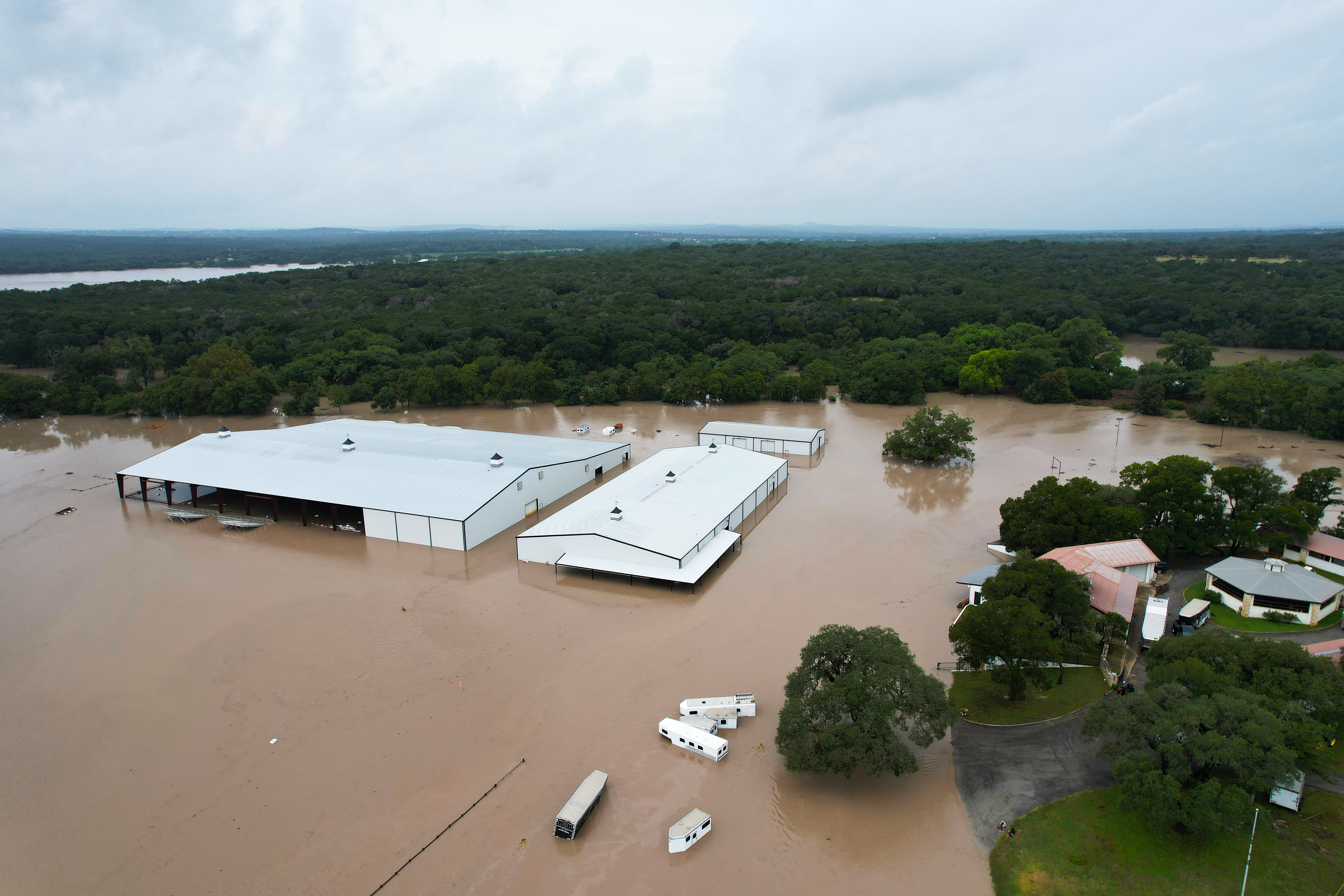 epaselect epa13116175 An aerial view taken with a drone shows floodwater at Corrival Horse Ranch near the Guadalupe River in Sisterdale, Texas, USA, 16 July 2026. Severe flooding affected parts of South-Central Texas and the Texas Hill Country, with a dangerous flood wave moving down the Guadalupe River, according to the National Weather Service. EPA/DUSTIN SAFRANEK