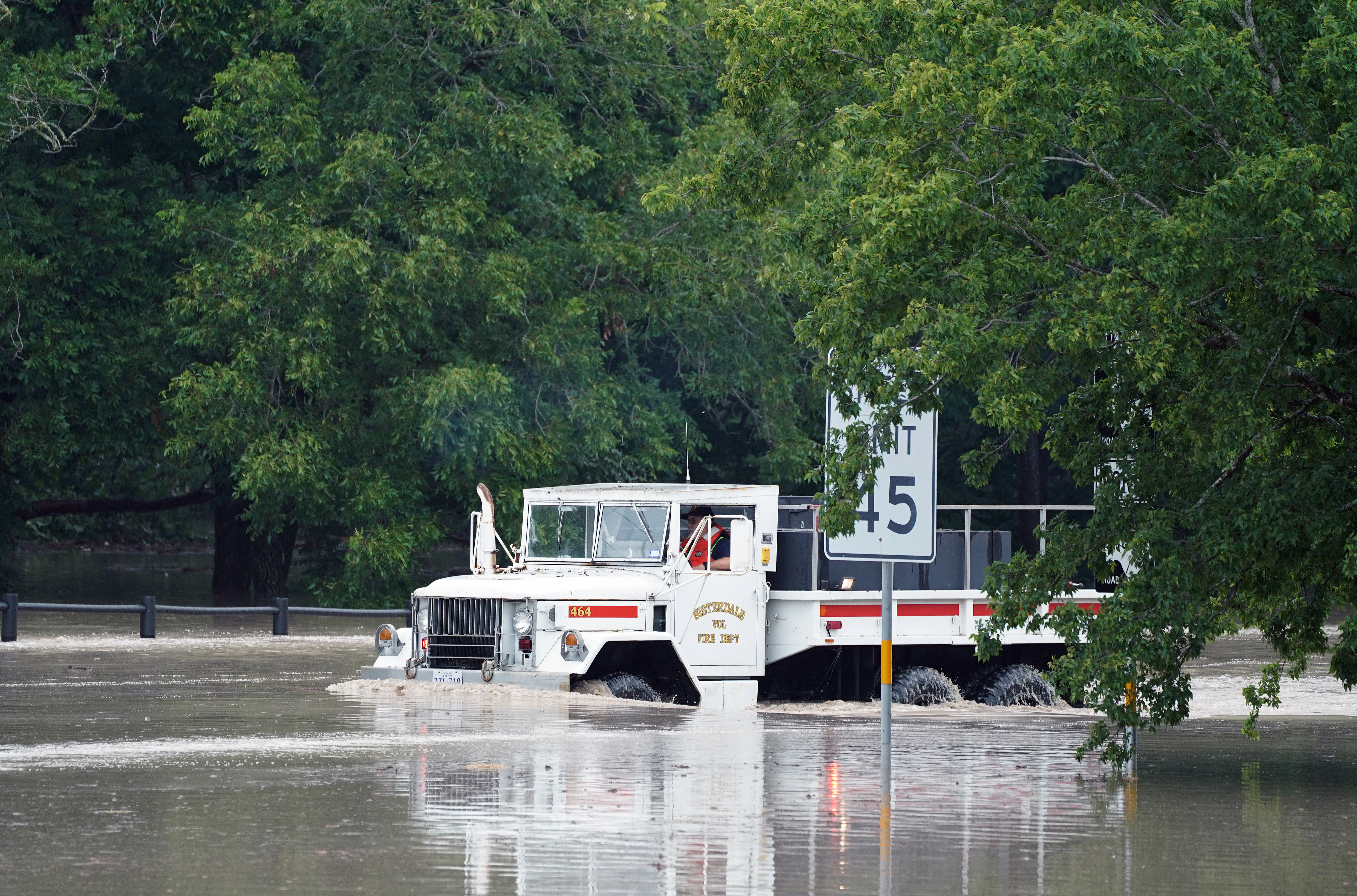 epa13115781 A Sisterdale Volunteer Fire Department truck moves through a high water near the Guadalupe River in Sisterdale,Texas, USA, 16 July 2026. Severe flooding is affecting parts of South-Central Texas and the Hill Country, particularly along the Guadalupe River. EPA/DUSTIN SAFRANEK