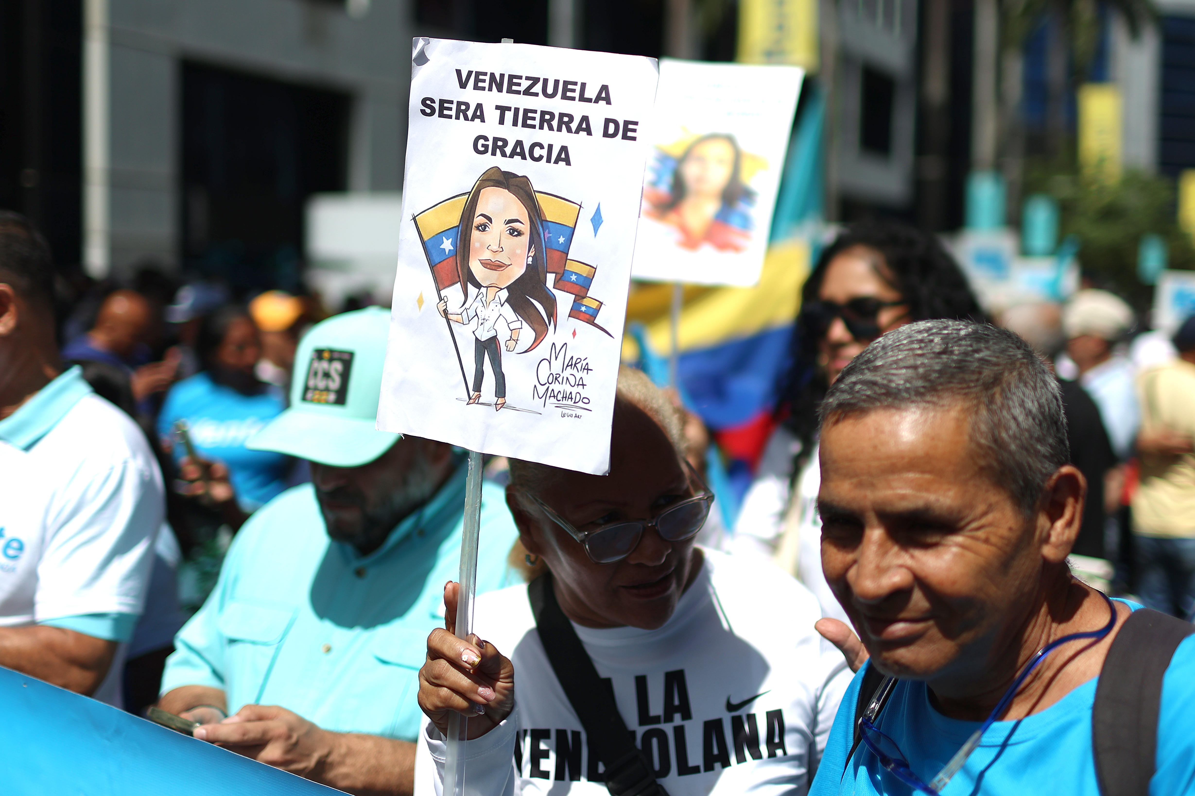 epa13137630 People protest during a demonstration in Caracas, Venezuela, 28 July 2026. The Venezuelan opposition, led by Nobel Peace Prize laureate Maria Corina Machado, called on its supporters to take part in a nationwide event to defend freedom “through organization, presence, and leadership in the streets.” EPA/MIGUEL GUTIERREZ