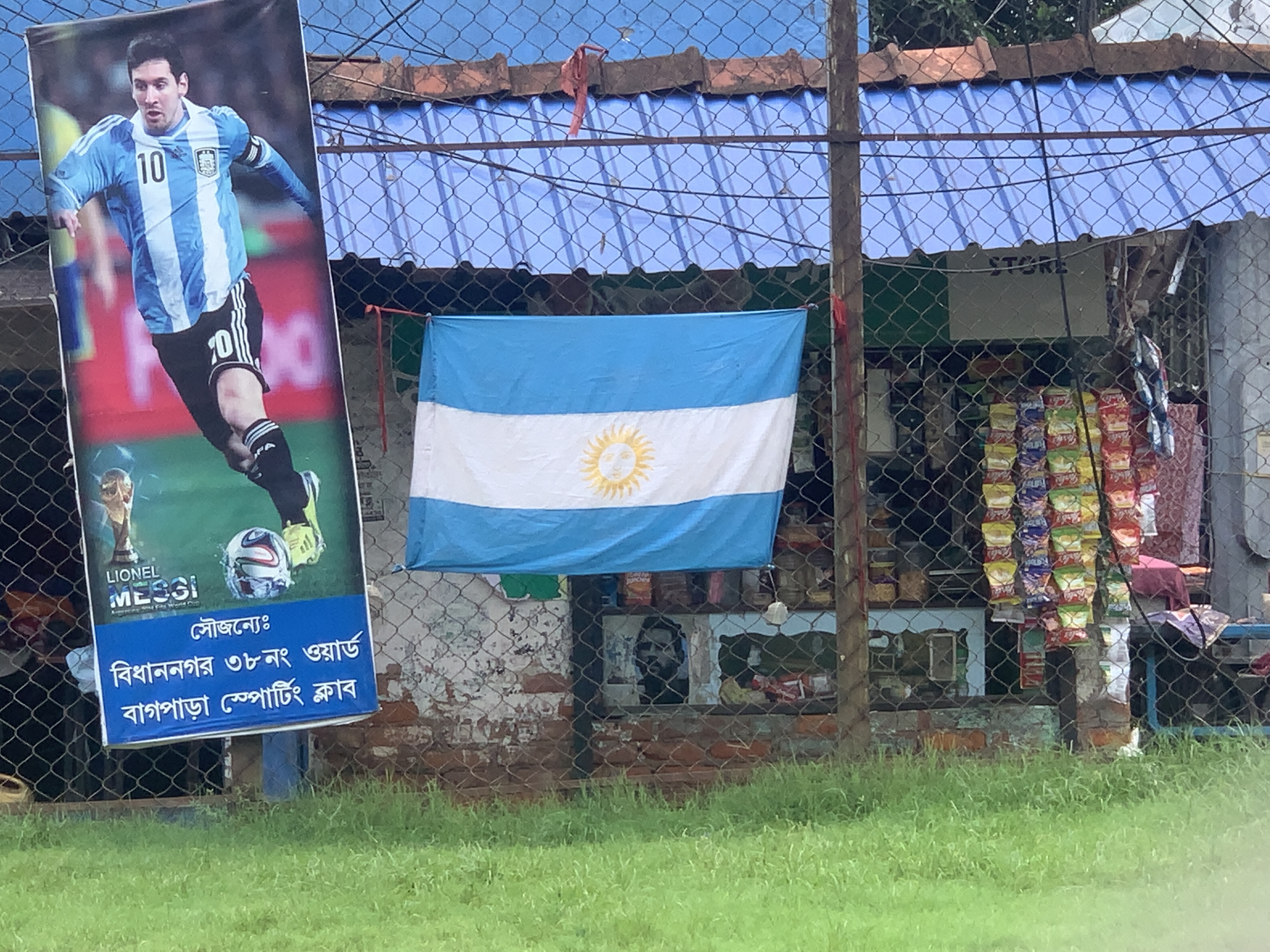 Argentina's flag and a poster of Messi is featured outside a tea shop near Salt Lake Stadium [Chandrahas Choudhury/Al Jazeera]