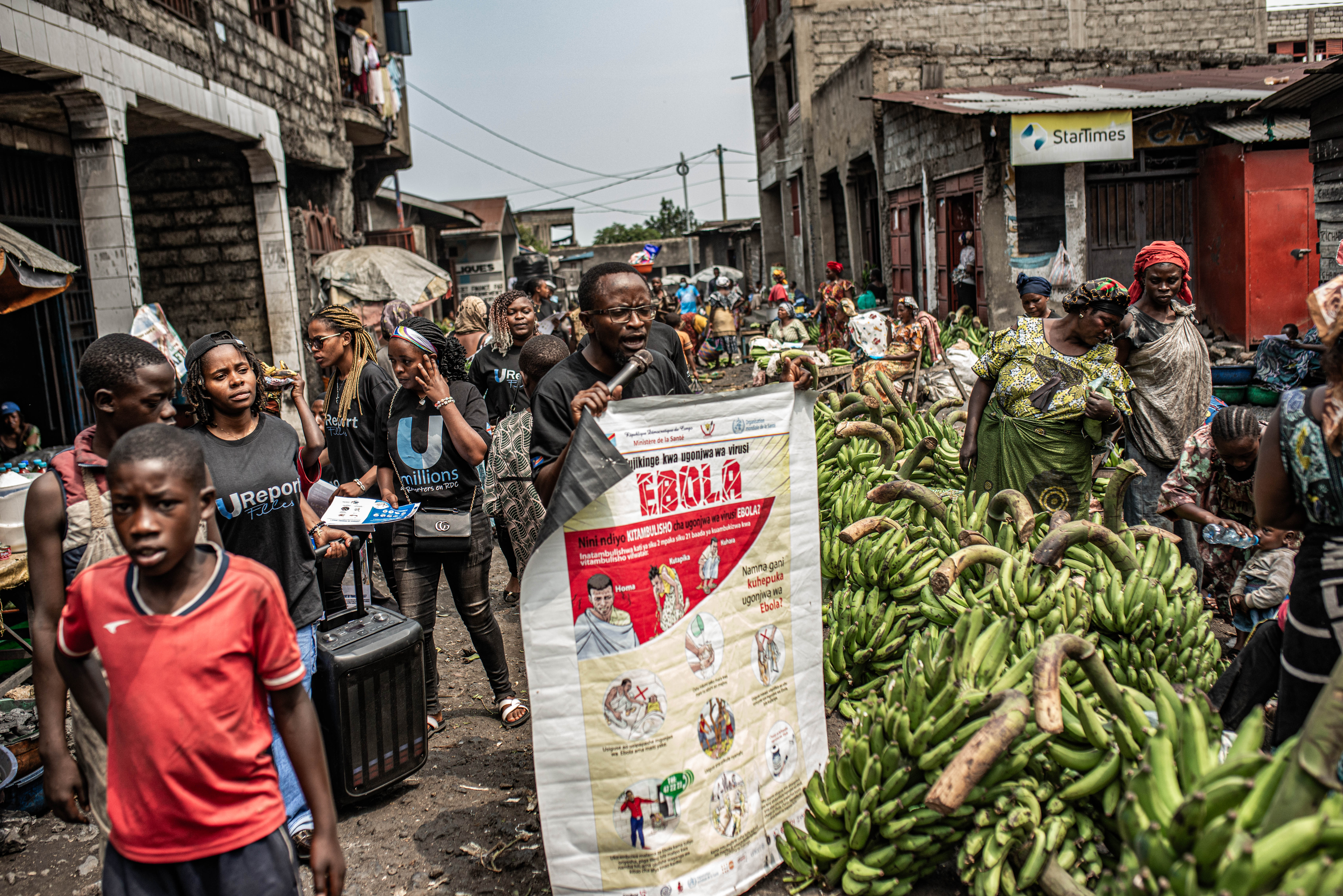 GOMA, DEMOCRATIC REPUBLIC OF CONGO - JUNE 24: Workers with UNICEF's 'U-Report' group raise awareness about Ebola transmission at Alanine market on June 24, 2026 in Goma, Democratic Republic of Congo. On Monday, UN agencies announced that Ebola cases in the Democratic Republic of Congo had surpassed 1,000. Although testing capacity has recently improved, surveillance and contact tracing remain constrained by insecurity and restricted access in Ituri province, the heart of the current outbreak, north of Goma. (Photo by Daniel Buuma/Getty Images)