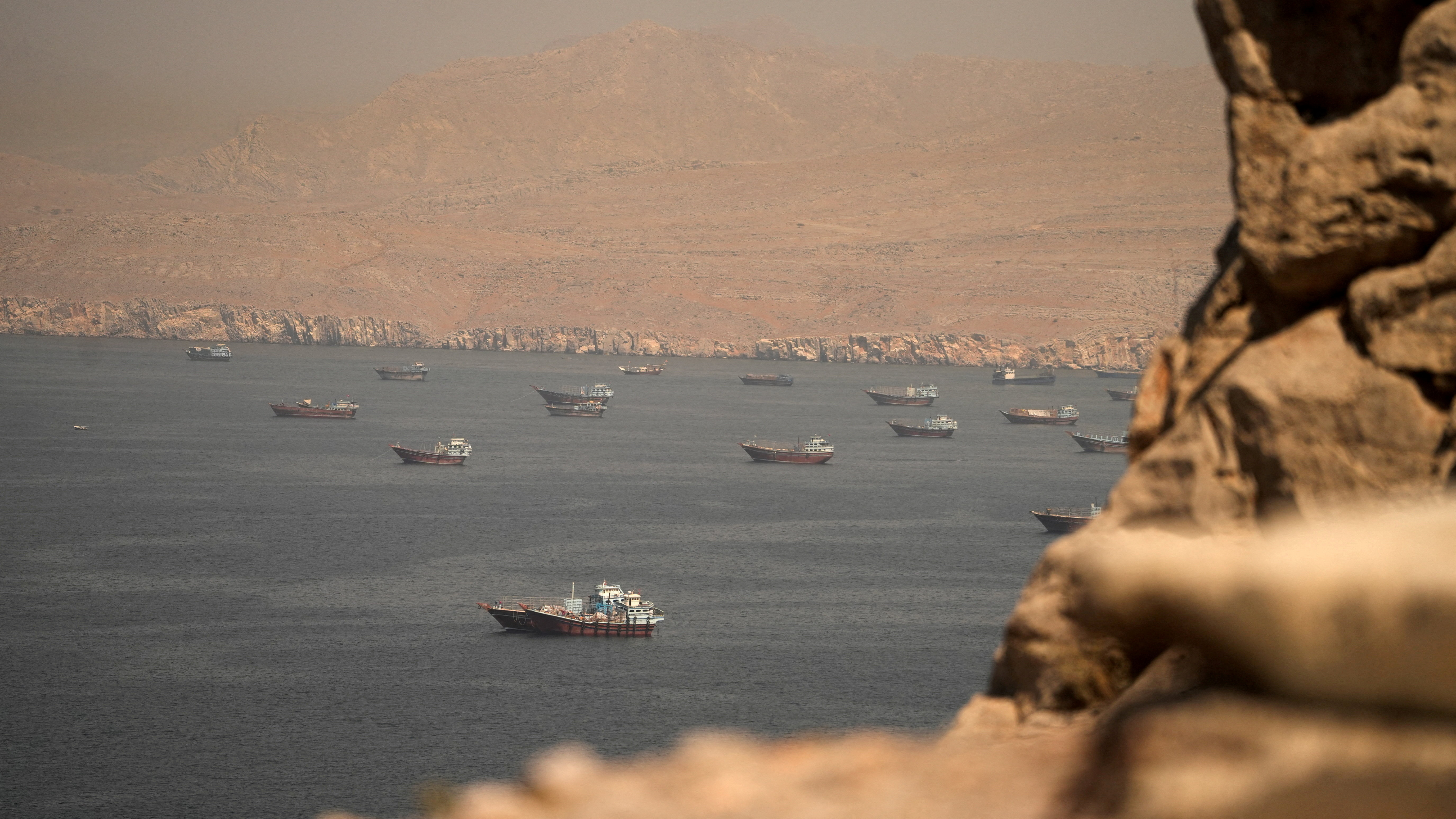 FILE PHOTO: Vessels at the Strait of Hormuz, as seen from Musandam, Oman, [Reuters]