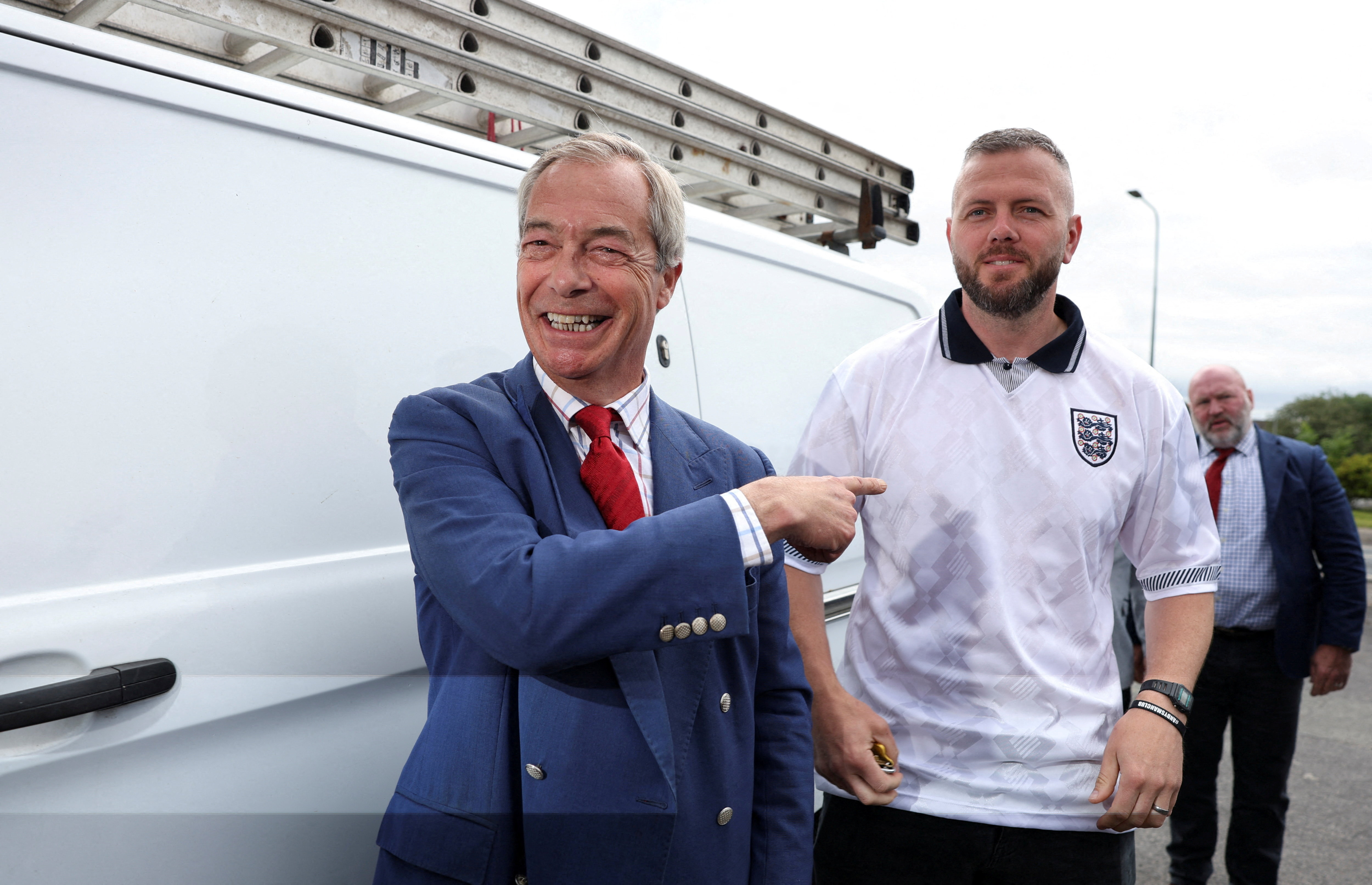 The Reform UK leader with the party’s by-election candidate in Makerfield, where analysts say the party underperformed amid questions over Farage’s personal finances. [Reuters]