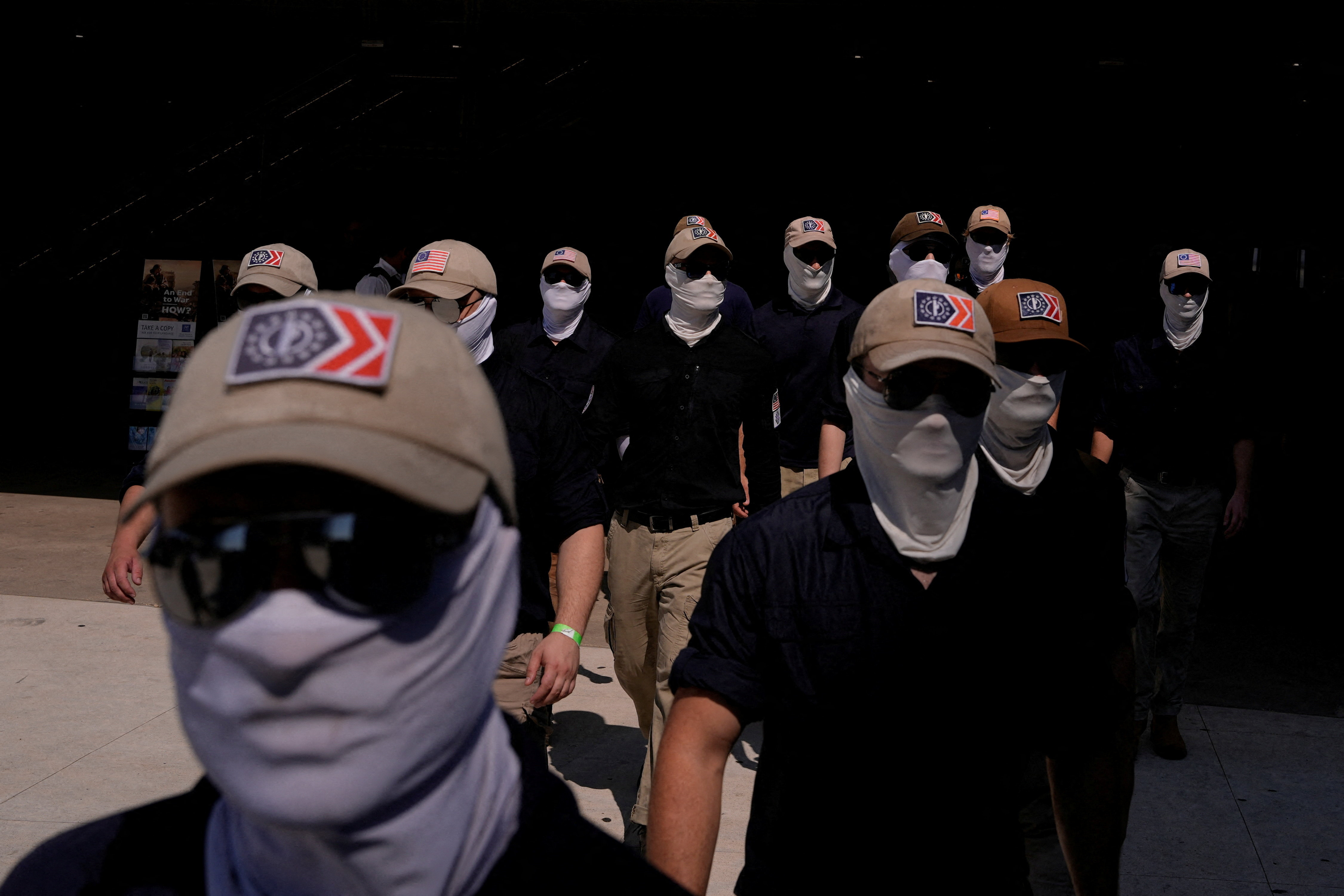Members of the group Patriot Front exit a metro station, on the 250th anniversary of U.S. independence in New Carrollton, Maryland, U.S, July 4, 2026. REUTERS/Cheney Orr REFILE - CORRECTING LOCATION FROM "WASHINGTON, D.C" TO "NEW CARROLLTON, MARYLAND".
