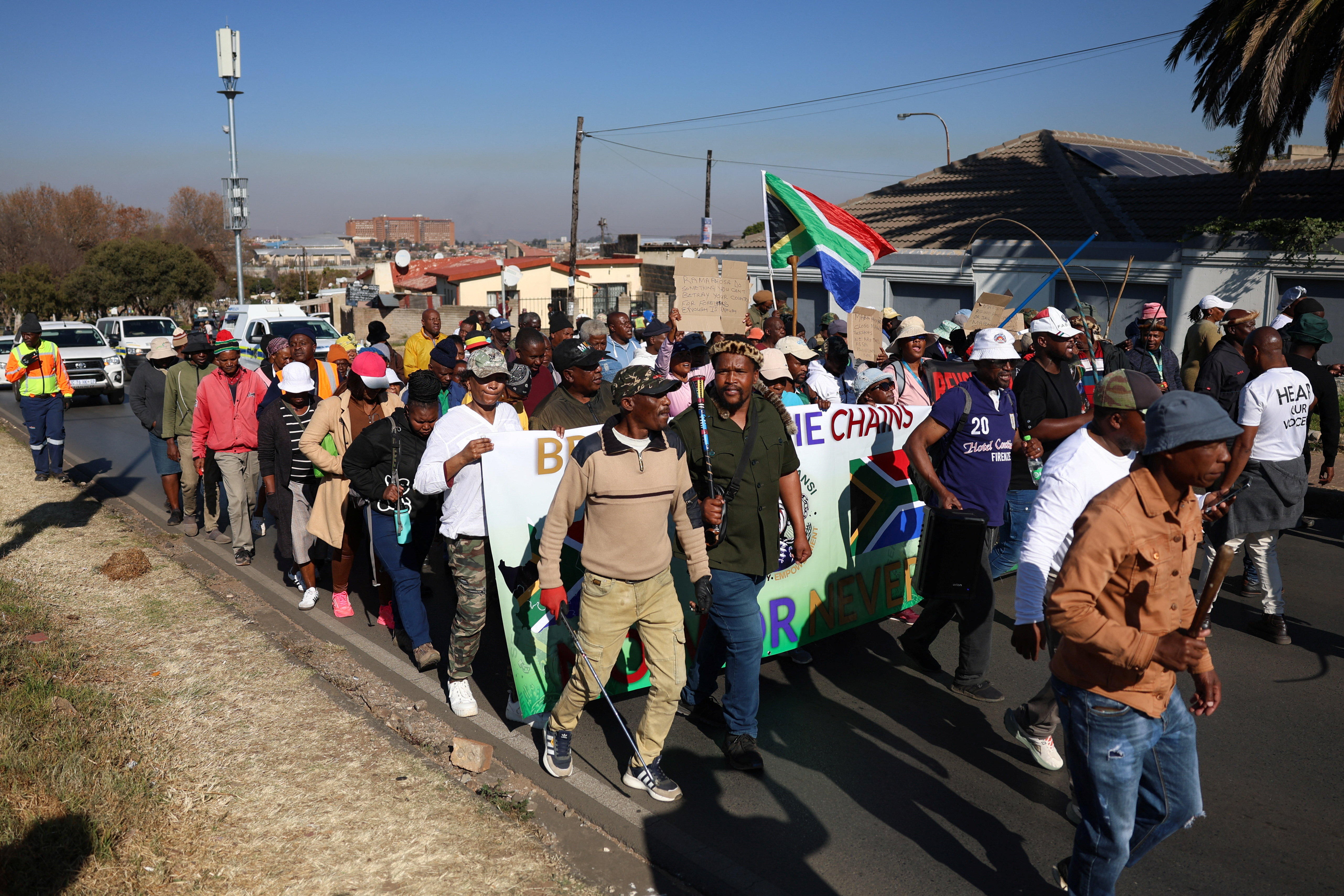 Anti-immigrant protesters march in Johannesburg, South Africa, after an unofficial June 30 deadline set for undocumented migrants to leave the country passed [Oupa Nkosi/Reuters]