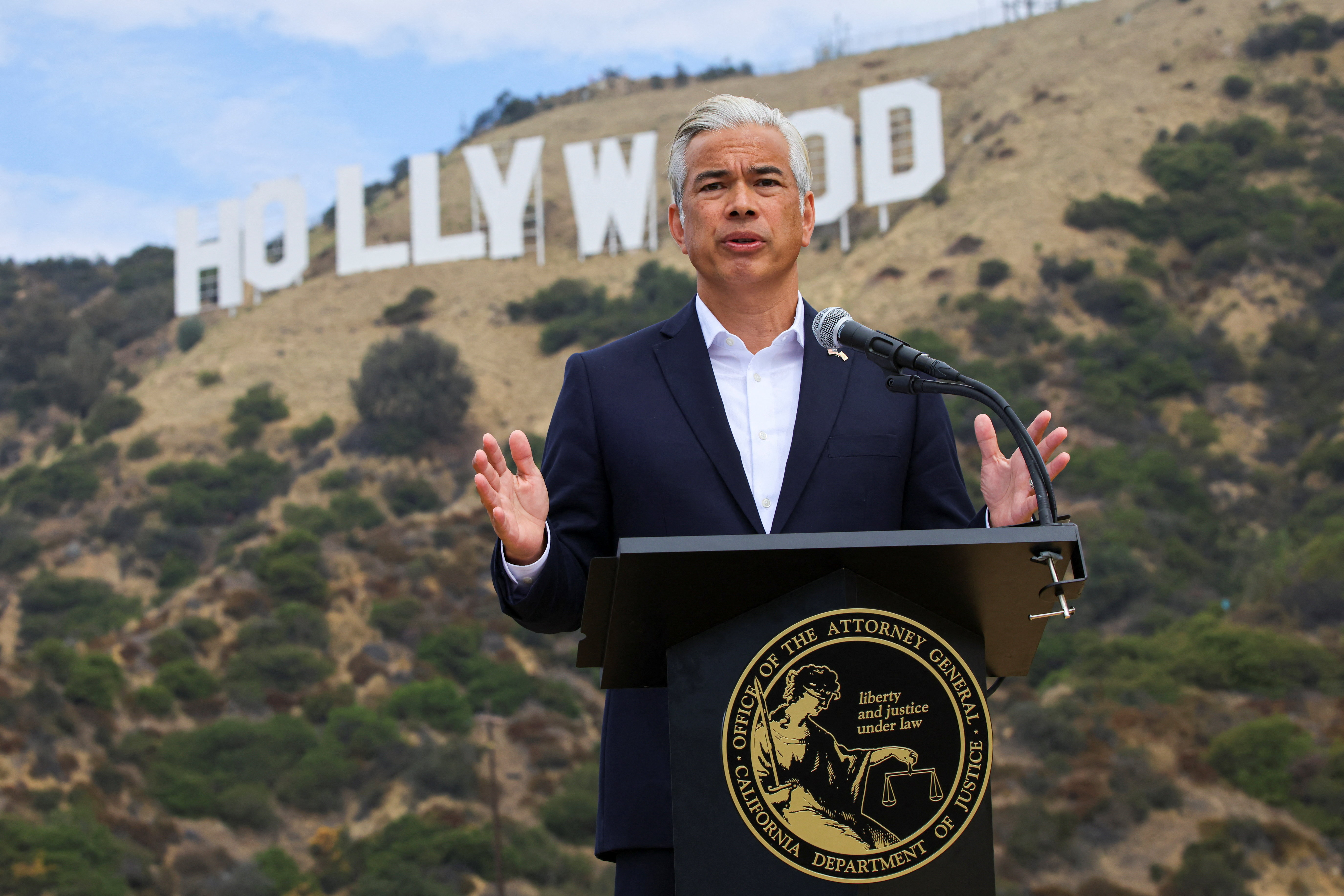 California Attorney General Rob Bonta holds a press conference, next to the iconic Hollywood sign, as he announces California will be suing to block the Paramount's $110 billion acquisition of Warner Bros. Discovery in Los Angeles, California, U.S. July 13, 2026. REUTERS/Daniel Cole