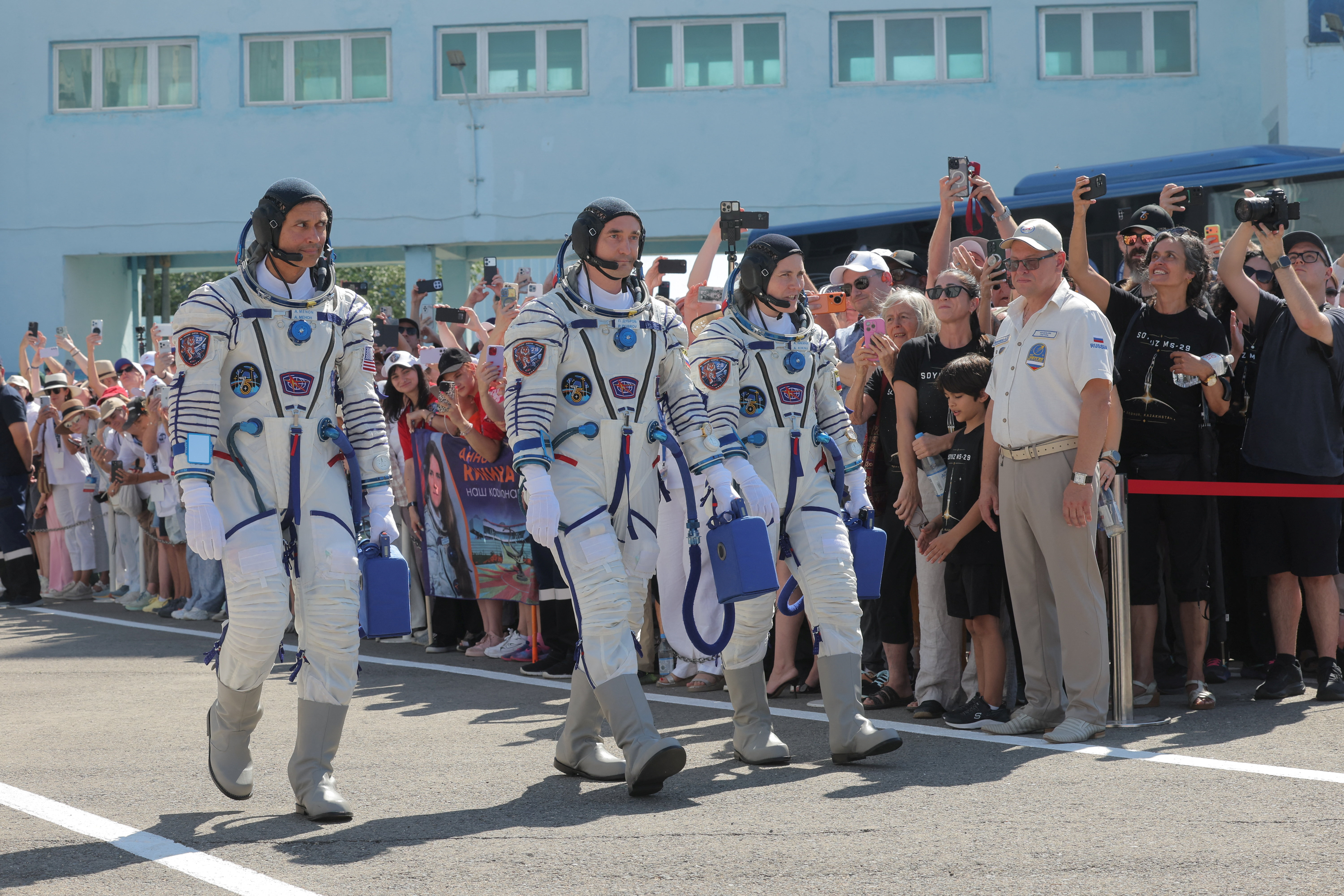 Crew members NASA astronaut Anil Menon, and Roscosmos cosmonauts Pyotr Dubrov and Anna Kikina attend a send-off ceremony before the launch of the Soyuz MS-29 spacecraft at the Baikonur cosmodrome in Baikonur, Kazakhstan, 14 July 2026. NASA astronaut Anil Menon, and Roscosmos cosmonauts Pyotr Dubrov and Anna Kikina will launch on Soyuz MS-29 to the International Space Station (ISS) on 14 July 2026. MAXIM SHIPENKOV/Pool via REUTERS