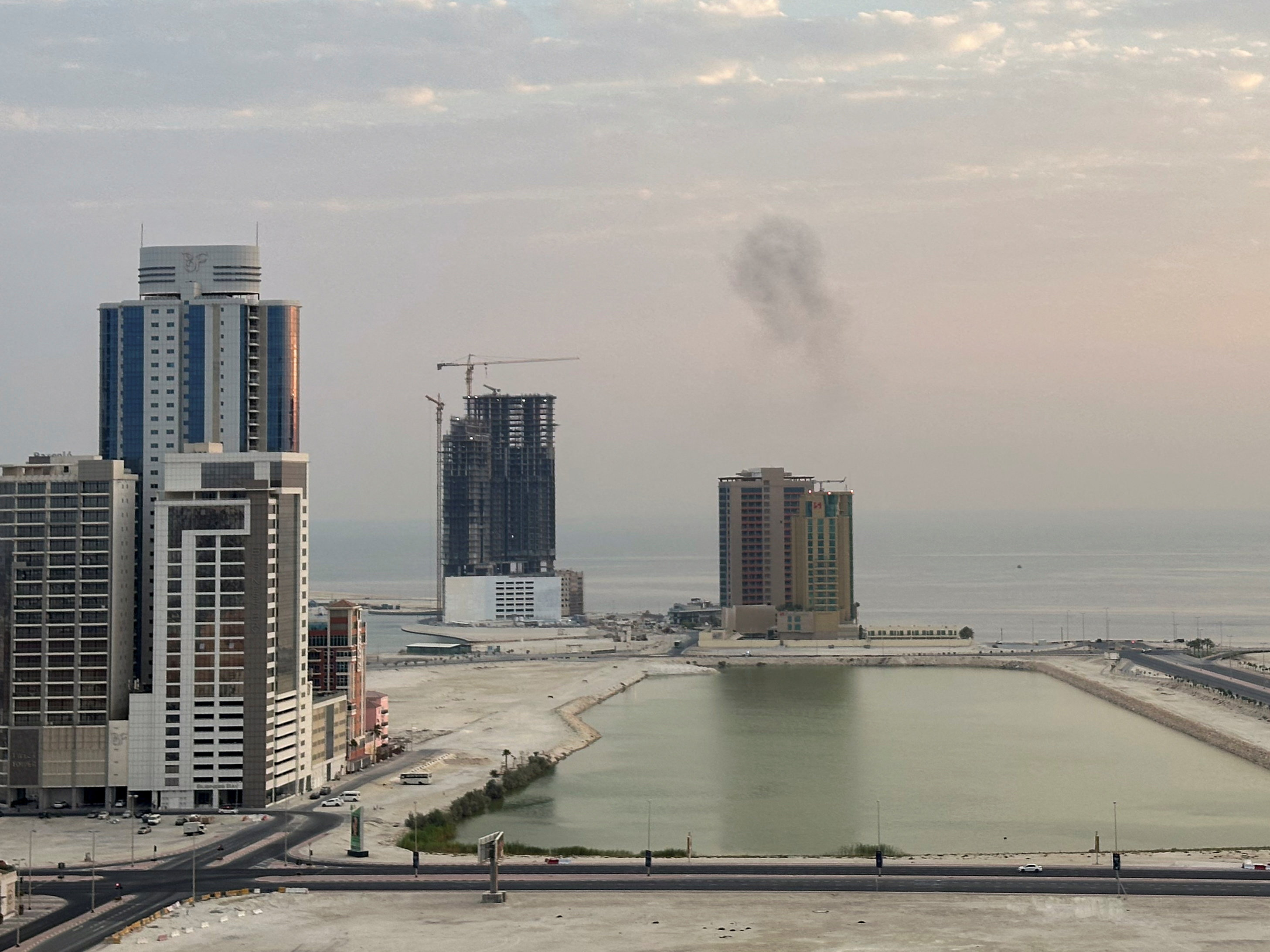 Smoke rises after a drone was intercepted during early morning hours in Manama, Bahrain, July 14, 2026. REUTERS/Stringer