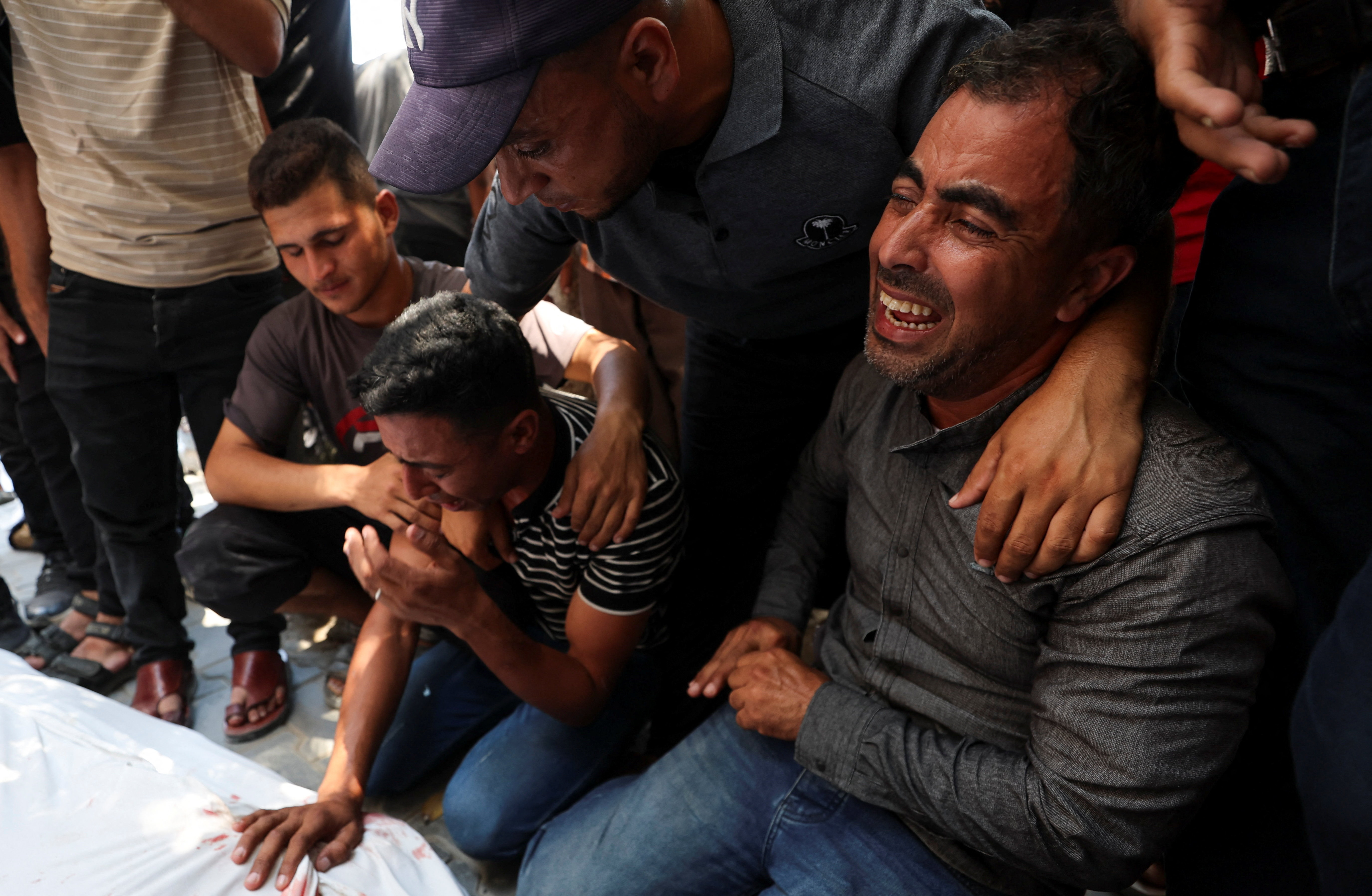 Mourners during the funeral of six Palestinian police officers who were killed in an Israeli attack on a police station