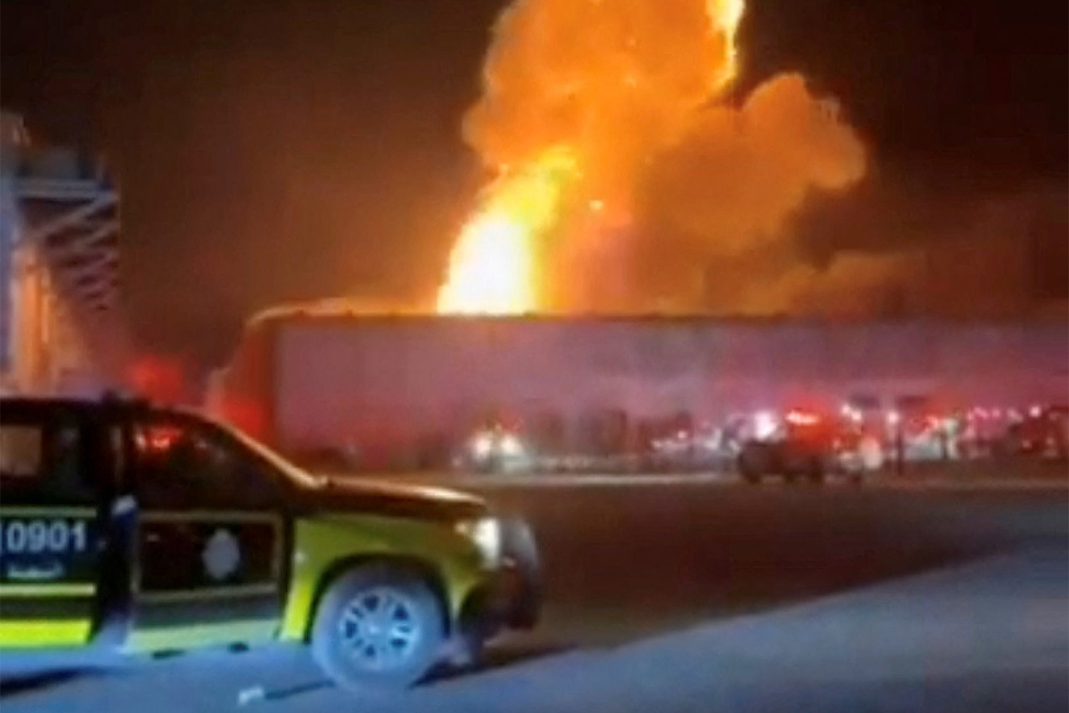 Smoke rises from an explosion following a drone strike on a warehouse in Al Shuaiba, Kuwait, in this still image obtained from social media video released July 14, 2026. Social Media/via REUTERS THIS IMAGE HAS BEEN SUPPLIED BY A THIRD PARTY. NO RESALES. NO ARCHIVES. NEWS USE ONLY. VERIFICATION: - Buildings, road layout and installation on structures that matched archive and satellite images. - Coordinates of the targeted facility: 28.97135377218665, 48.08348359588447. - Exact time not verified but no older version found posted online before July 14. - Iran’s Revolutionary Guards confirmed its strikes on Kuwait on Tuesday evening. - Kuwait Army confirmed in a statement that several vital and civilian facilities were targeted by Iranian forces on the evening of July 14. - NASA FIRMS detected thermal activity in the area on early morning of July 15.