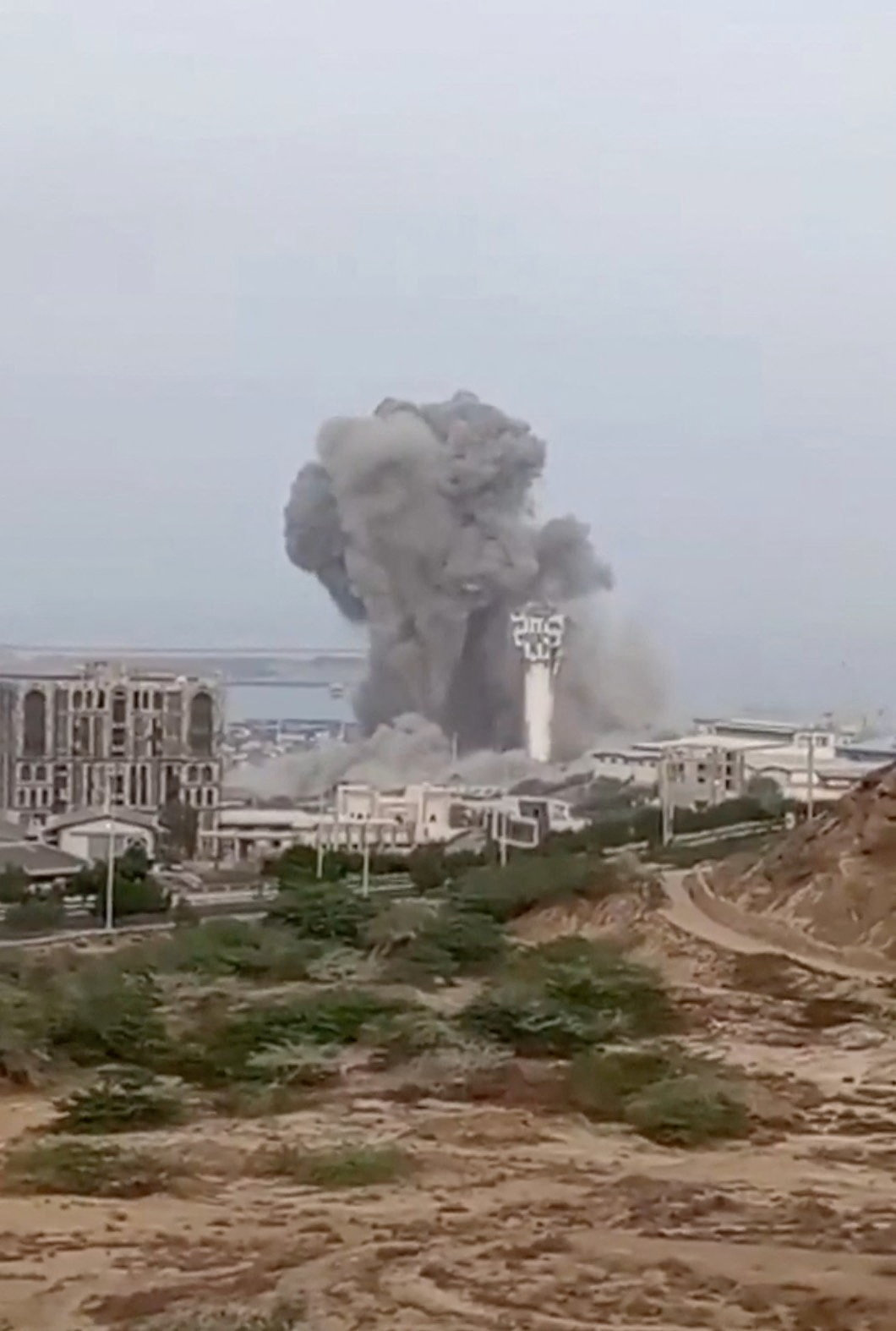 Smoke rises in Chabahar, Iran, in this screengrab taken from a social media video, released July 15, 2026. Social Media/via REUTERS THIS IMAGE HAS BEEN SUPPLIED BY A THIRD PARTY. NO RESALES. NO ARCHIVES. NEWS USE ONLY. VERIFICATION: - Tower, buildings, and terrain matched archive and satellite imagery - Exact date when the video was filmed could not be verified - Verified corroborating visuals show the same tower and plume of smoke - No older versions of the video were found posted online before July 15