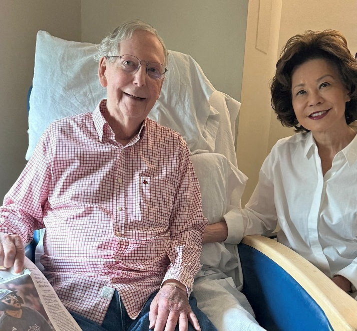 U.S. Senator Mitch McConnell (R-KY) sits with his wife, former United States secretary of labor Elaine Chao, while holding what appears to be the July 12 sports section of the Washington Post in a photograph released by his office in Washington, D.C., U.S. July 12, 2026. Office of Senator Mitch McConnell/Handout via REUTERS. THIS IMAGE HAS BEEN SUPPLIED BY A THIRD PARTY TPX IMAGES OF THE DAY