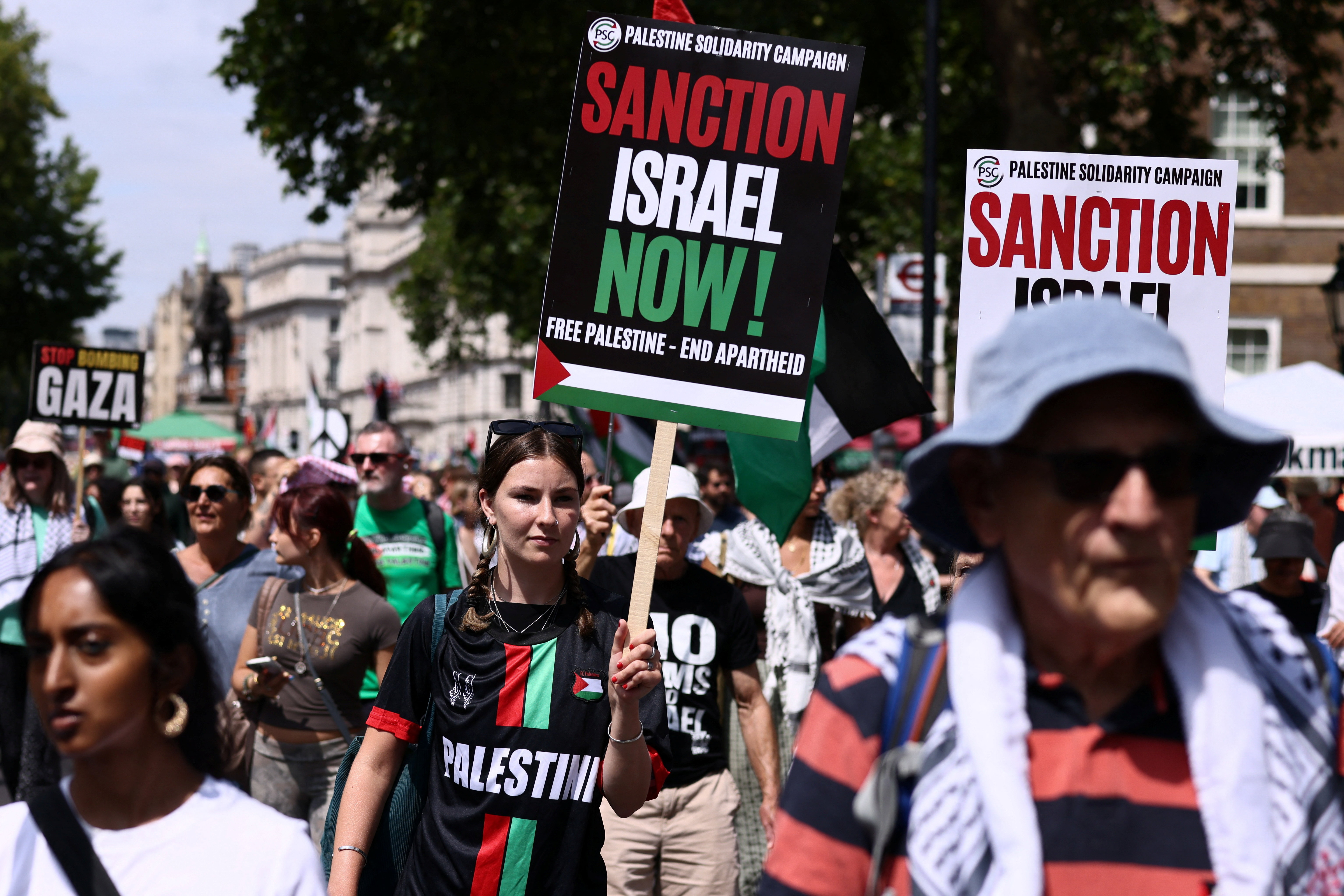 People carry placards during a "National March for Palestine" calling on Britain's next Prime Minister, Andy Burnham, to stand up for the Palestinian people, in London, Britain, July 18, 2026. REUTERS/Jack Taylor